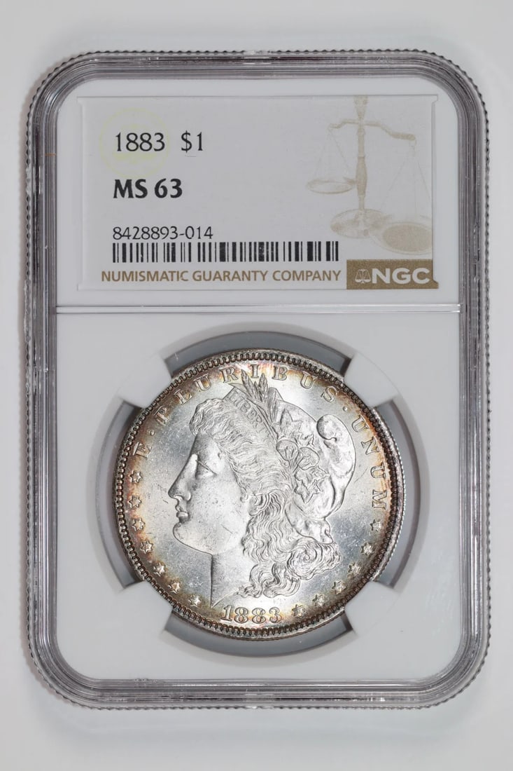 Morgan Dollar (1883) - MS63: Morgan Dollar (1883) - MS63 A rare and highly sought-after 1883 Morgan Dollar, certified MS63 by the Numismatic Guaranty Corporation (NGC), boasts exceptional silver content and stunning condition. Th