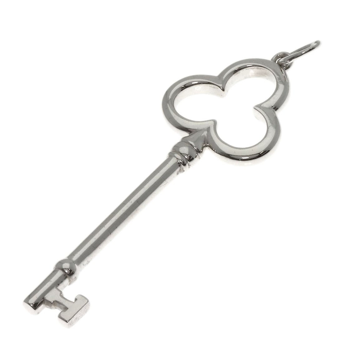 Silver TIFFANY&Co. Open Trefoil Key Medium Pendant top: Silver TIFFANY&Co. Open Trefoil Key Medium Pendant top A stunning silver pendant from Tiffany&Co., the Open Trefoil Key Medium Pendant top boasts an elegant trefoil design that adds a touch of