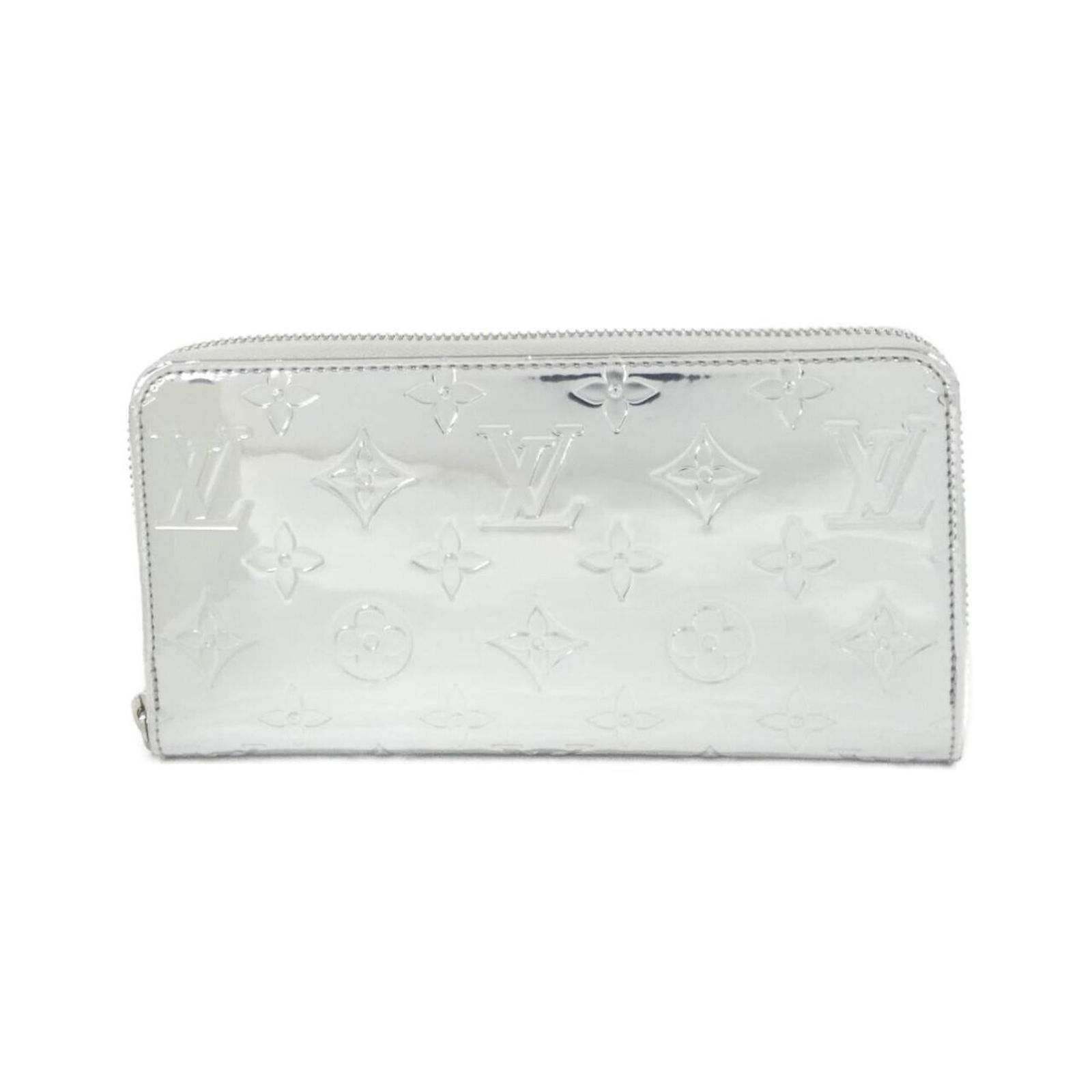 Louis Vuitton Bi-Fold Leather Wallet: Louis Vuitton Bi-Fold Leather Wallet A timeless piece from the iconic Louis Vuitton brand, this bi-fold leather wallet boasts sleek silver enamel accents and premium leather construction. With its