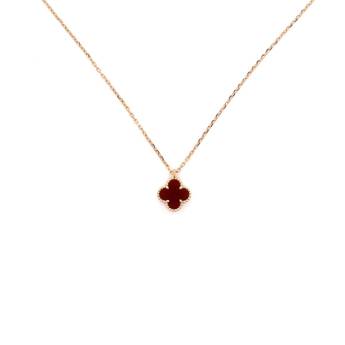 Van Cleef & Arpels Sweet Alhambra Pendant Necklace in 18K Rose Gold with Carnelian: Van Cleef & Arpels Sweet Alhambra Pendant Necklace in 18K Rose Gold with Carnelian Elevate your elegance with the iconic Sweet Alhambra Pendant Necklace, crafted in 18K rose gold and adorned with