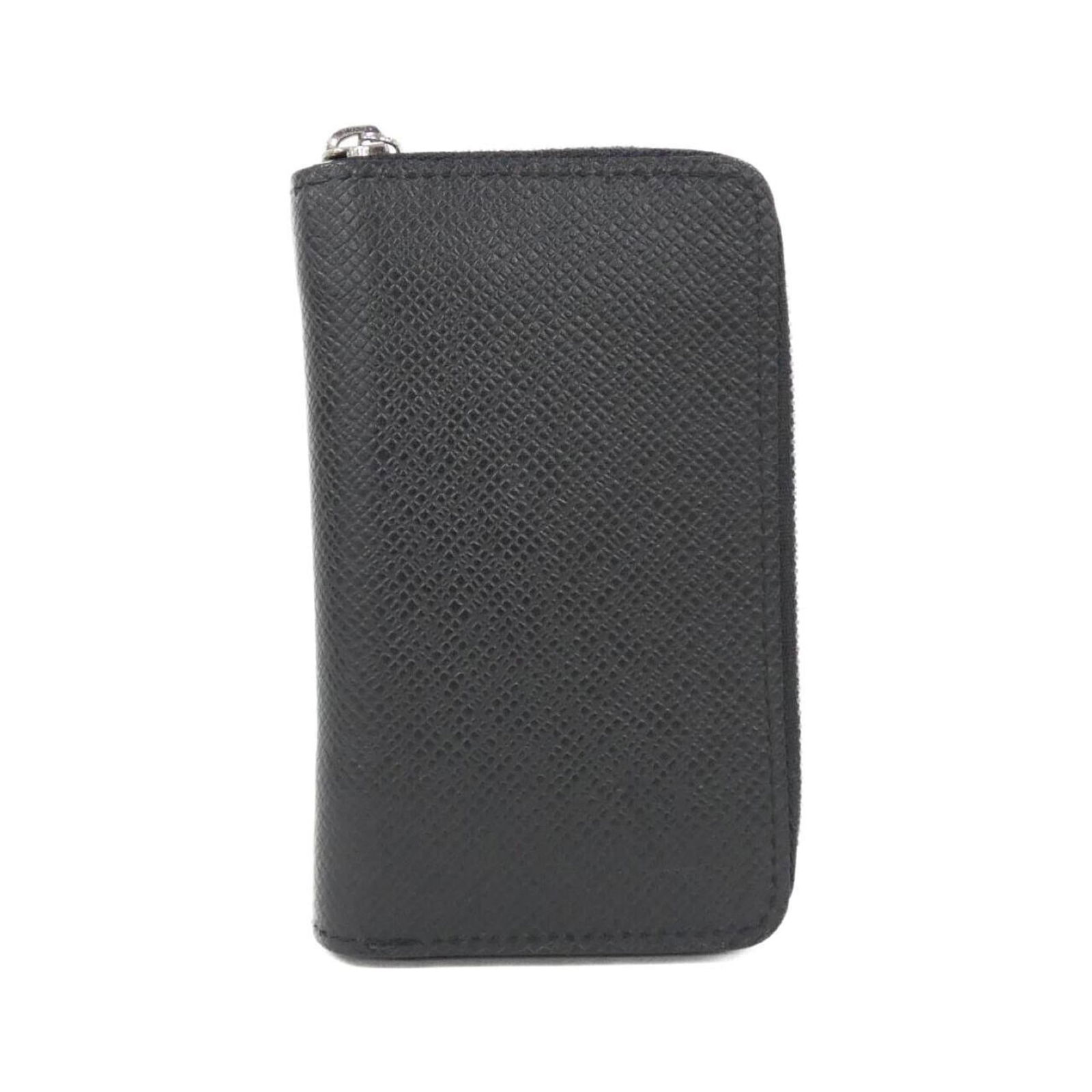 Louis Vuitton Coin Purse/ Case Leather: Louis Vuitton Coin Purse/ Case Leather A sleek and sophisticated accessory for the modern gentleman, this Louis Vuitton coin purse is crafted from high-quality calfskin leather in classic black. Its