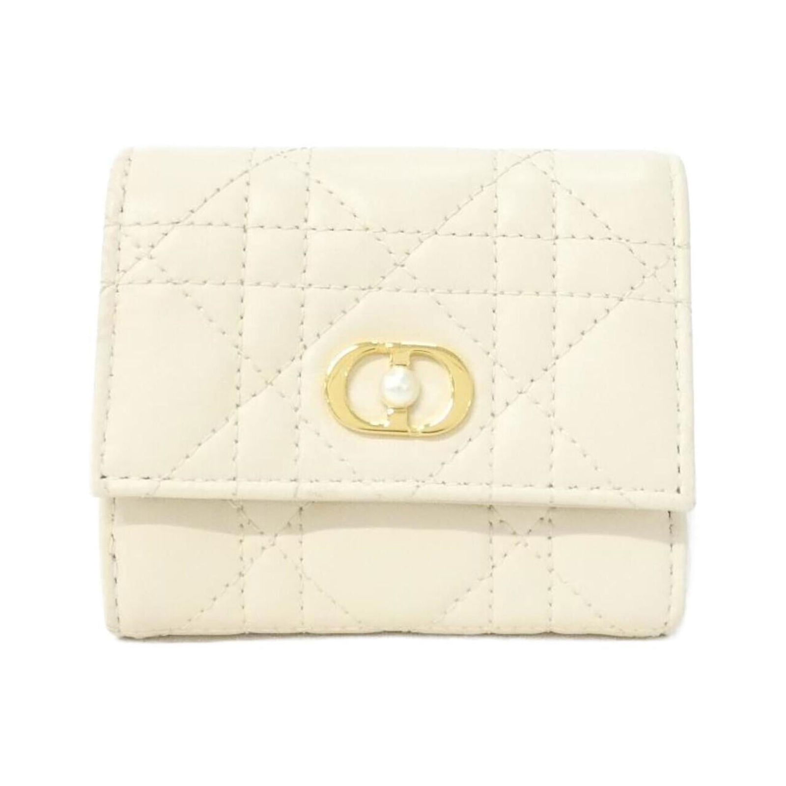 Christian Dior Tri-Fold Leather Wallet: Christian Dior Tri-Fold Leather Wallet A timeless piece from the iconic Christian Dior brand, this tri-fold leather wallet boasts elegant Off-White lamb leather and a classic design that exudes