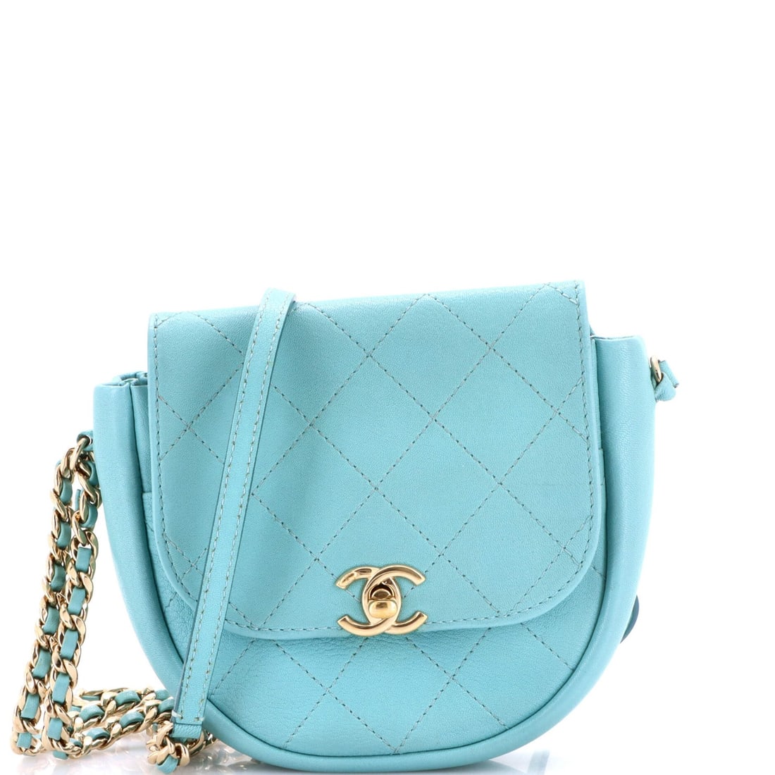 Mini Chanel Casual Trip Messenger Bag Quilted Lambskin: Mini Chanel Casual Trip Messenger Bag Quilted Lambskin Experience the timeless elegance of Chanel in this mini quilted lambskin messenger bag, boasting a sleek blue exterior and neutral interior. The