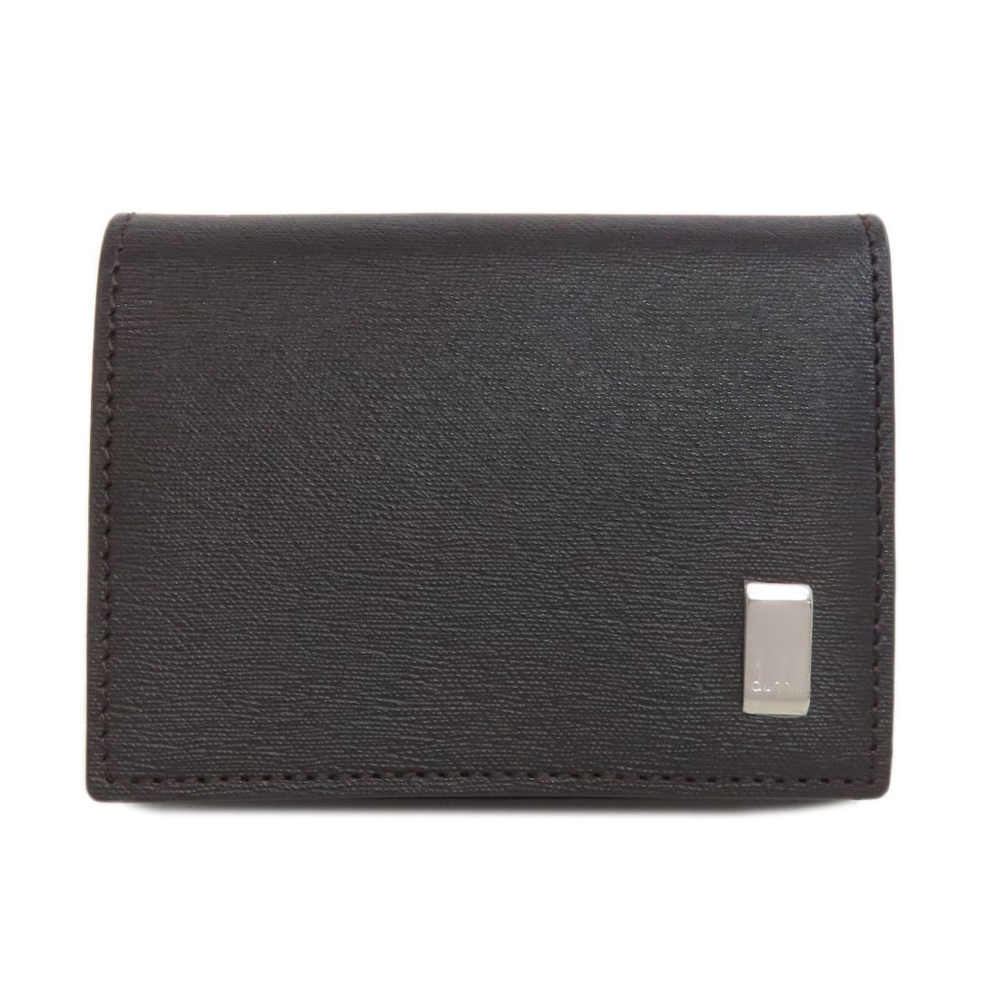 Dunhill Coin Purse in Leather: Dunhill Coin Purse in Leather A timeless accessory for the discerning gentleman, this Dunhill leather coin purse is crafted from rich, dark brown Italian leather that exudes sophistication and