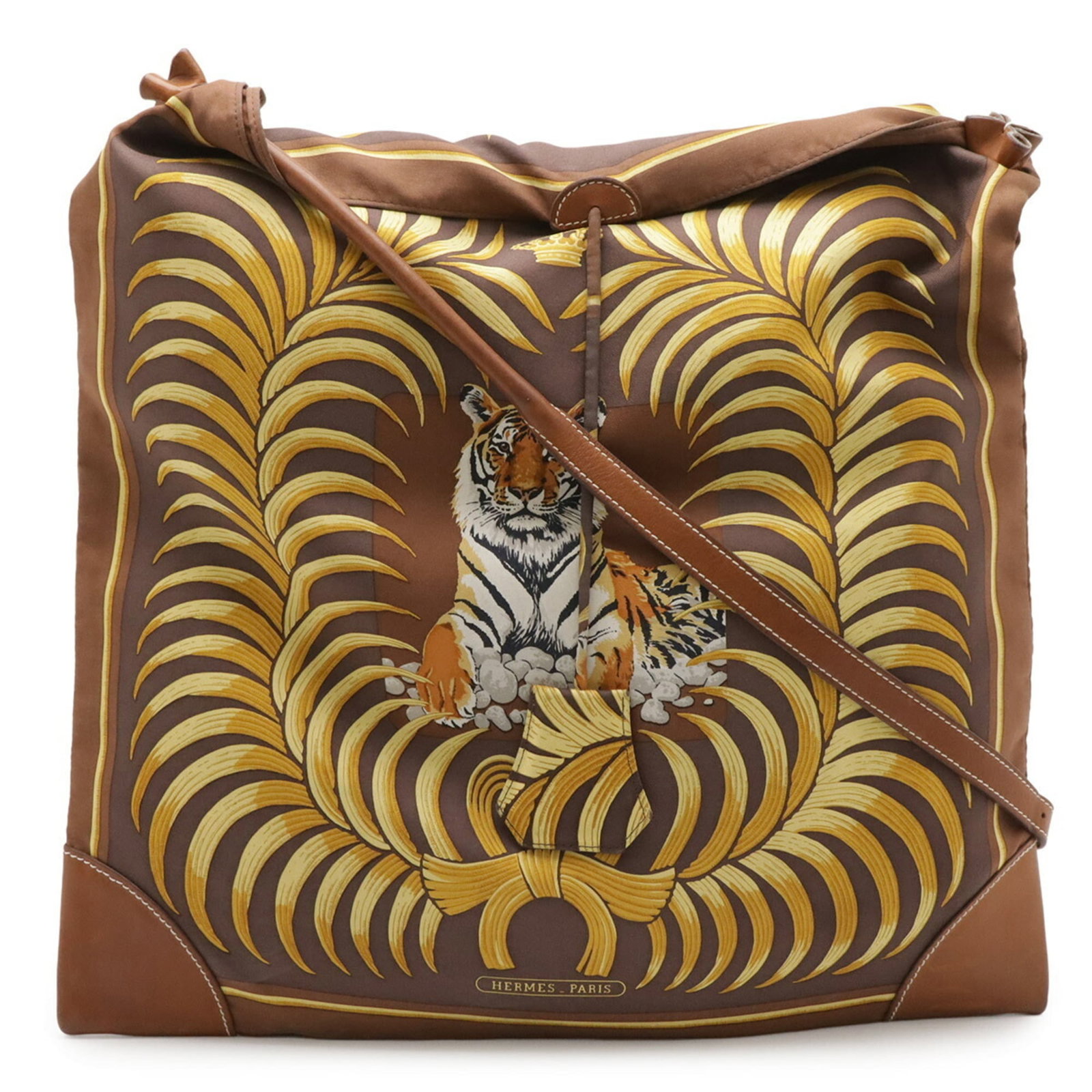 Hermes Silk and Leather Shoulder Bag: Hermes Silk and Leather Shoulder Bag A pre-owned Hermes shoulder bag in rich brown and multi-color, crafted from luxurious silk and supple leather. With its classic design and timeless elegance, this