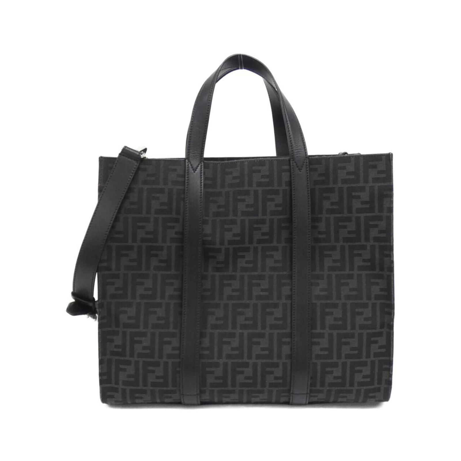 Fendi Canvas and Leather Handbag: Fendi Canvas and Leather Handbag Elevate your style with the iconic Fendi canvas and leather handbag, boasting a sleek black design that exudes sophistication. Crafted from high-quality calfskin