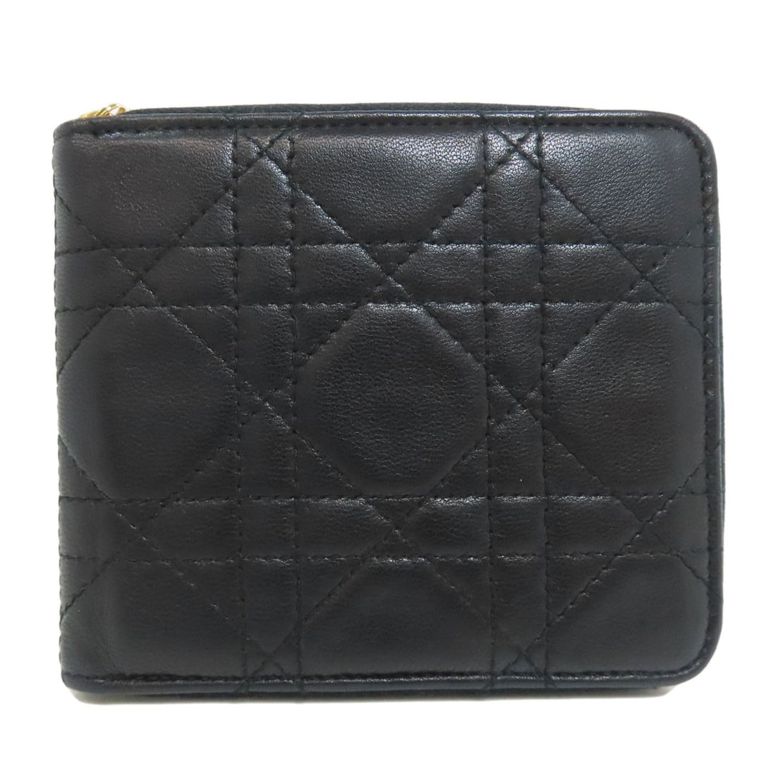 Christian Dior Canage Bifold Wallet with Coin Pocket in Lambskin: Christian Dior Canage Bifold Wallet with Coin Pocket in Lambskin The Christian Dior Canage Bifold Wallet is a timeless classic, boasting sleek black lambskin exterior and a spacious coin pocket for
