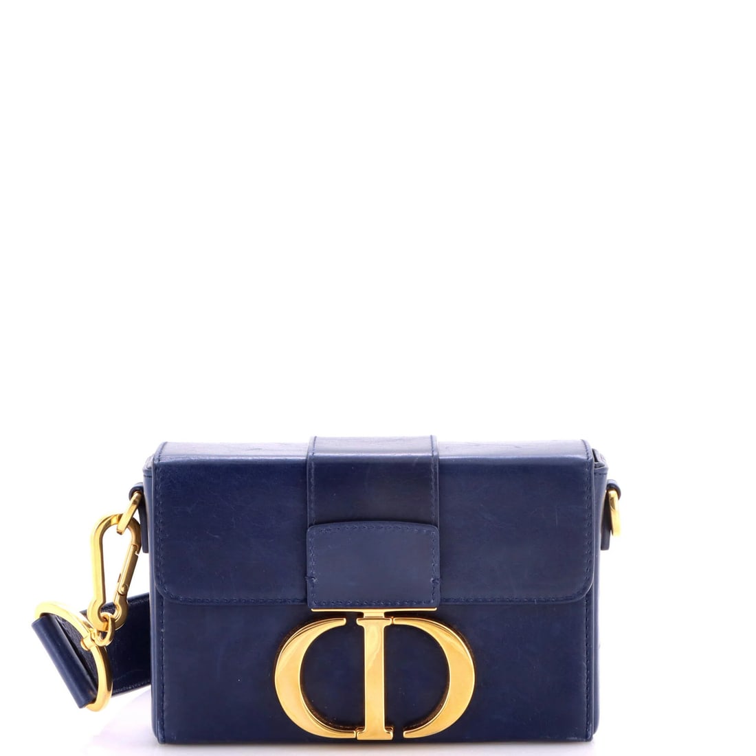 Christian Dior 30 Montaigne Box Bag in Leather: Christian Dior 30 Montaigne Box Bag in Leather The Christian Dior 30 Montaigne Box Bag is a stunning piece of luxury leather craftsmanship, boasting a sleek blue exterior with gold hardware and a