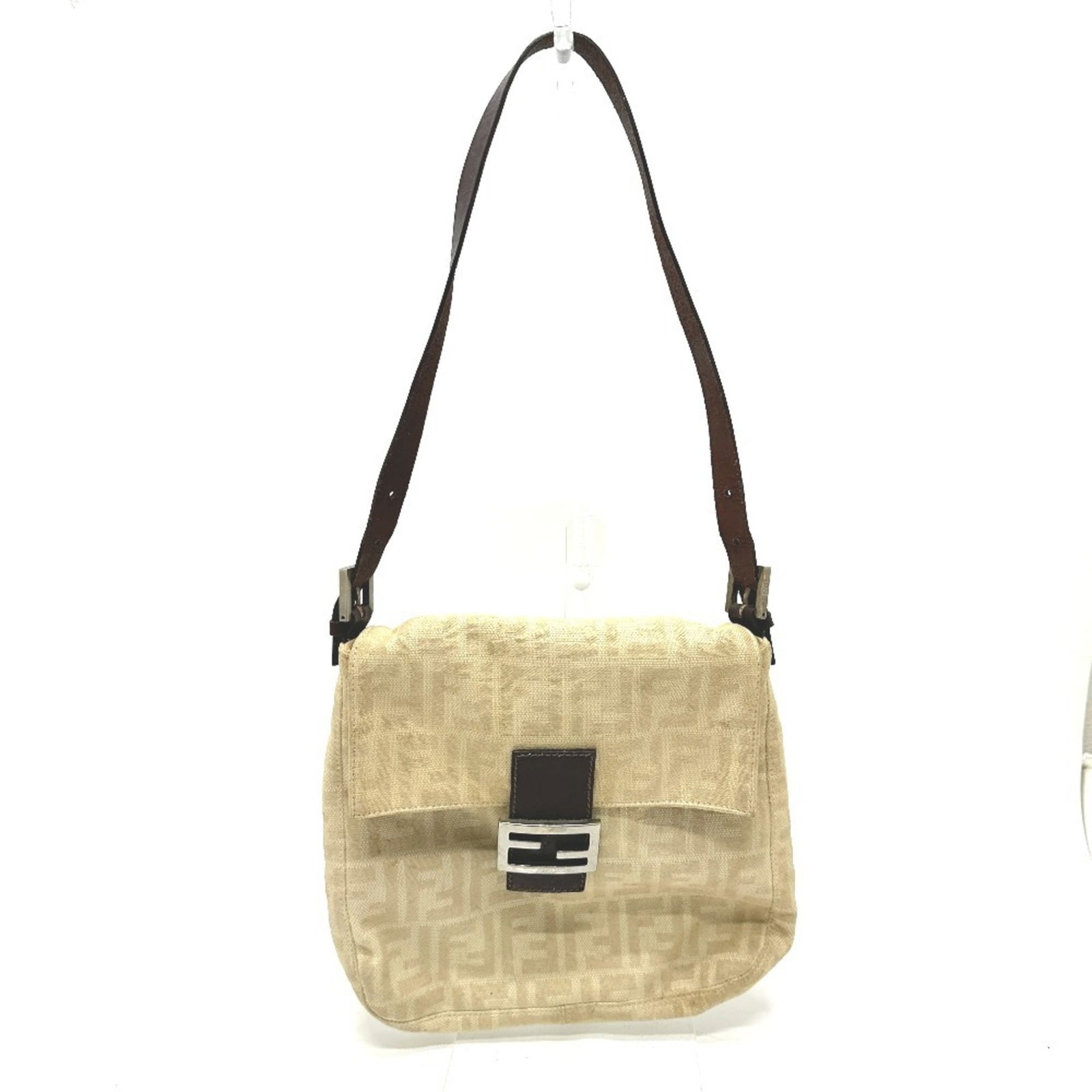 Fendi Canvas Shoulder Bag: Fendi Canvas Shoulder Bag A chic and timeless Fendi canvas shoulder bag in beige, perfect for adding an air of sophistication to any outfit. With its classic design and durable canvas material, this