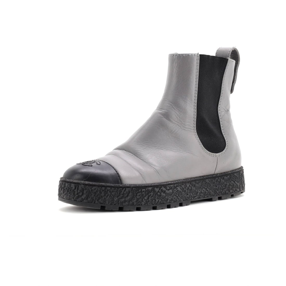 Chanel Women's CC Turnlock Cap-Toe Chelsea Boots in Leather: Chanel Women's CC Turnlock Cap-Toe Chelsea Boots in Leather Elevate your shoe game with the iconic Chanel CC Turnlock Cap-Toe Chelsea Boots, boasting sleek cap-toe design and signature turnlock