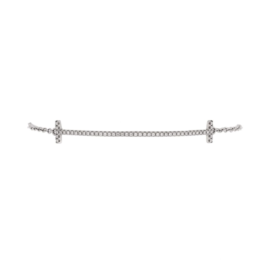 Medium Tiffany & Co. T Smile Chain Bracelet 18K White Gold with Diamonds: Medium Tiffany & Co. T Smile Chain Bracelet 18K White Gold with Diamonds A stunning 18K white gold Tiffany & Co. T Smile Chain bracelet boasts a delicate medium size and is adorned with sparkling