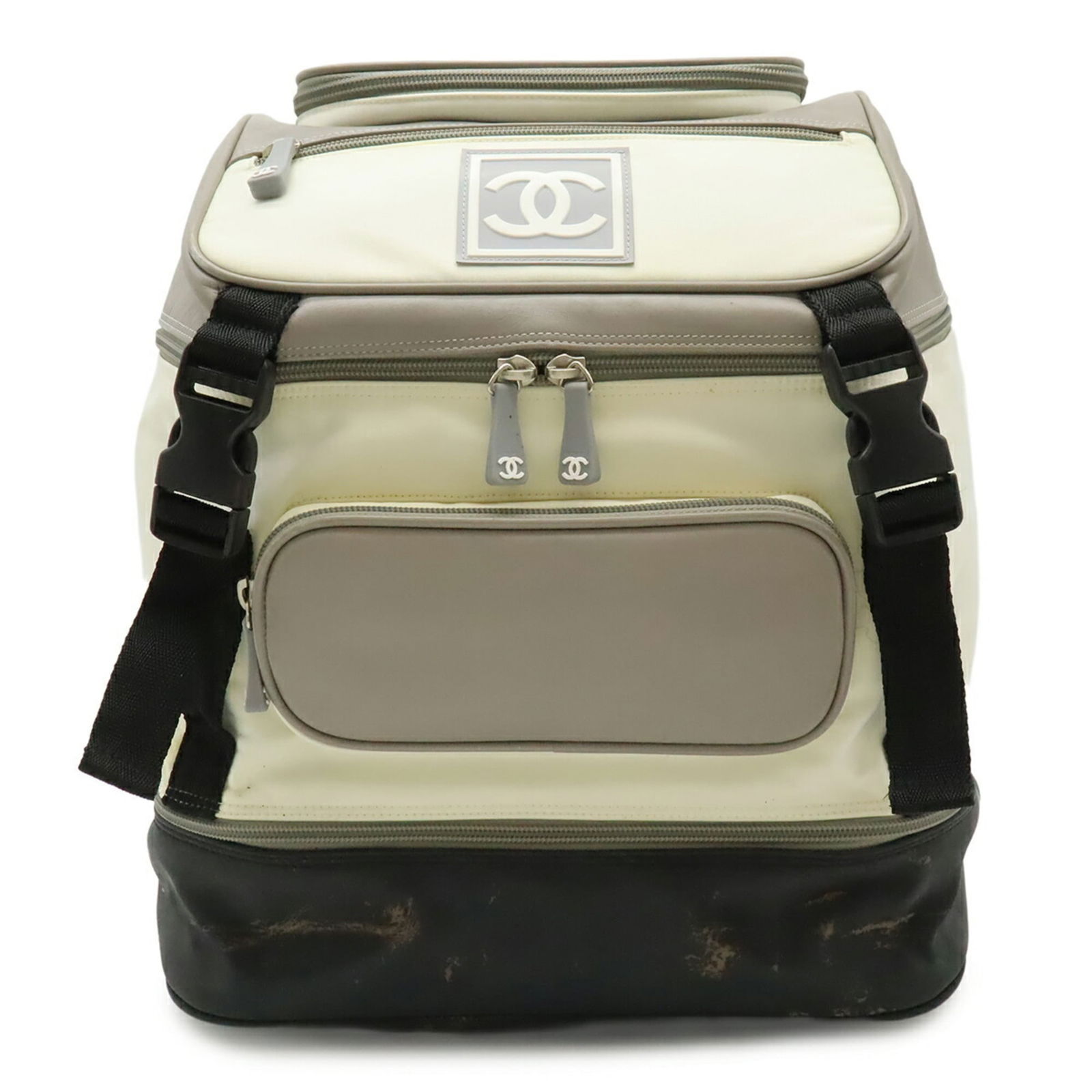 Chanel Backpack in Nylon, Rubber, and Leather: Chanel Backpack in Nylon, Rubber, and Leather A pre-owned Chanel backpack in impeccable condition, boasting the iconic interlocking CC clasp and durable nylon, rubber, and leather construction that