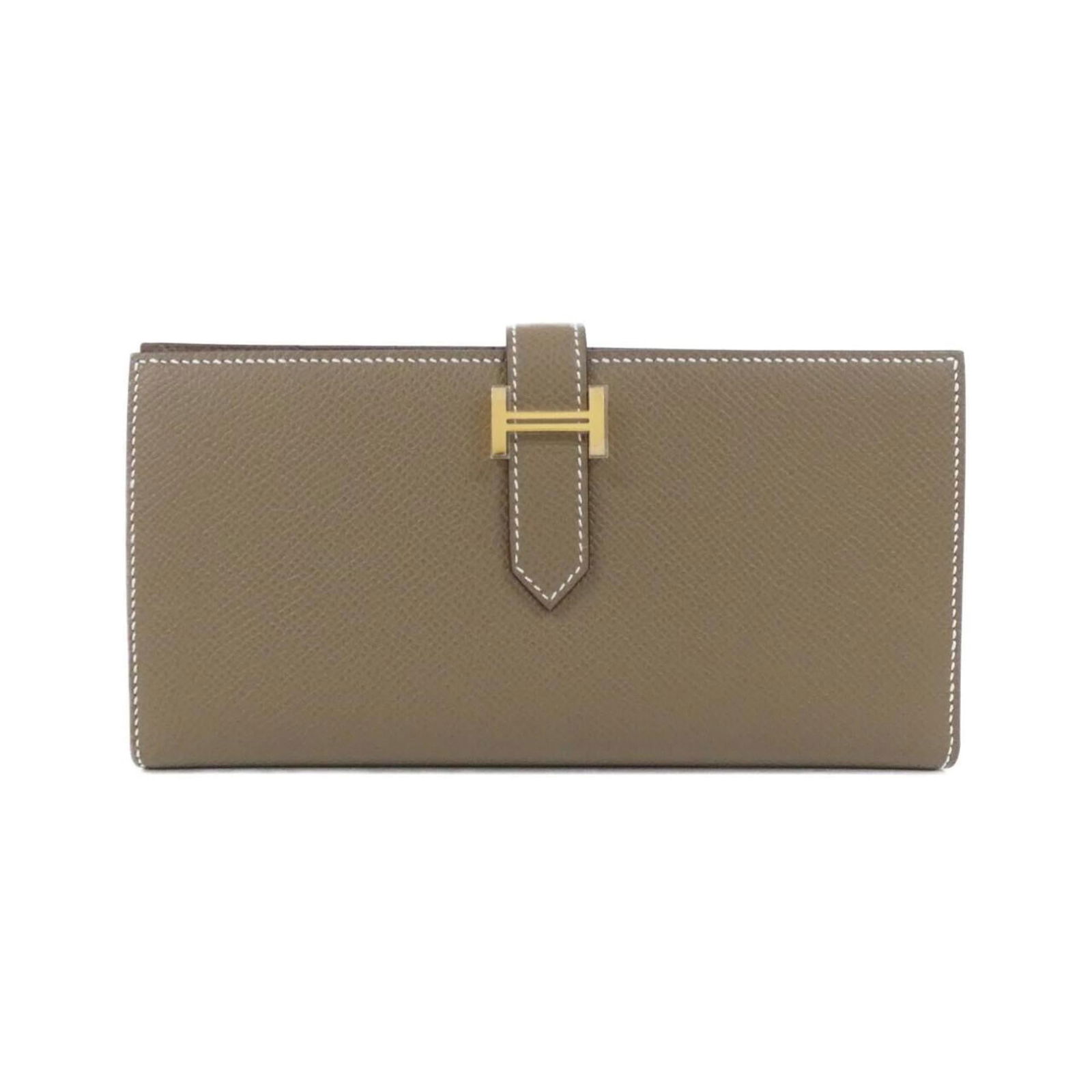 Hermes Bi-Fold Epsom Leather Wallet: Hermes Bi-Fold Epsom Leather Wallet A rare find for the discerning collector, this pre-owned Hermes Bi-Fold Epsom Leather Wallet boasts classic design and exceptional craftsmanship. With its rich