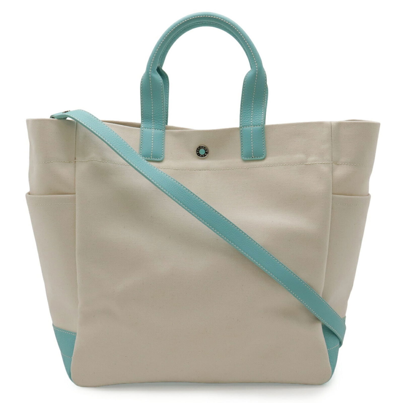 Tiffany Canvas Leather Shoulder Tote Bag: Tiffany Canvas Leather Shoulder Tote Bag A timeless and versatile shoulder tote, the Tiffany Canvas Leather bag boasts a chic ivory canvas exterior adorned with rich leather accents in a signature