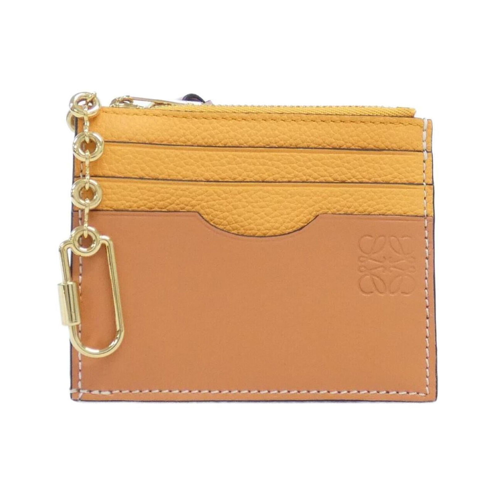 Loewe Coin Purse/ Case Leather: Loewe Coin Purse/ Case Leather A timeless piece from the renowned Spanish luxury brand Loewe, this classic coin purse/case is crafted from rich calfskin leather, exuding sophistication and elegance.