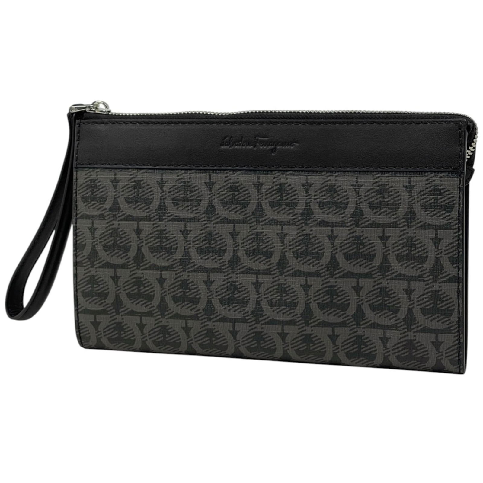 Salvatore Ferragamo Canvas and Leather Clutch Bag: Salvatore Ferragamo Canvas and Leather Clutch Bag A chic and sophisticated Salvatore Ferragamo clutch bag, crafted from coated canvas and supple leather in a timeless gray hue. With its sleek design