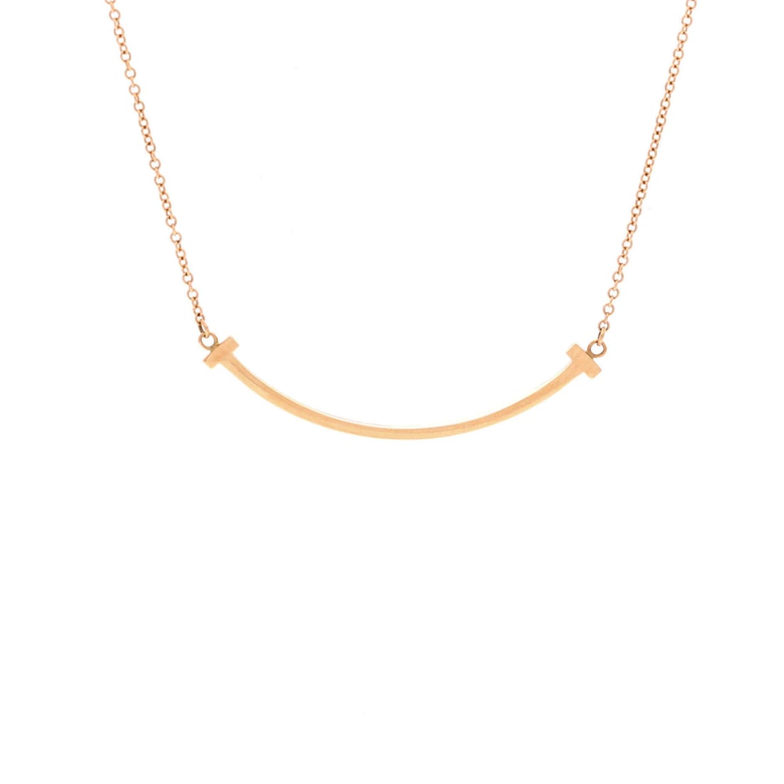 Tiffany & Co. T Smile Pendant Necklace in 18K Rose Gold: Tiffany & Co. T Smile Pendant Necklace in 18K Rose Gold Elevate your elegance with the iconic Tiffany & Co. T Smile Pendant Necklace, crafted in 18K rose gold and boasting an understated