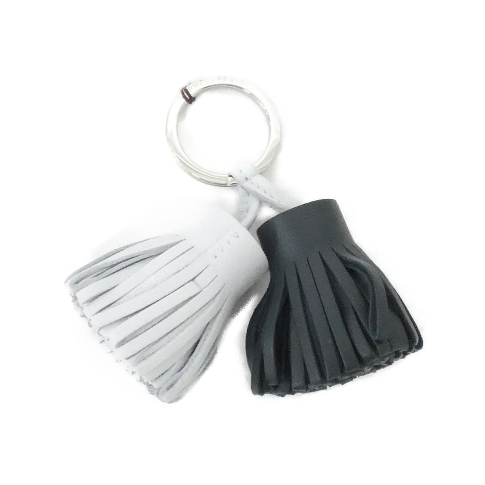 Hermes Agneau Milo Keyring: Hermes Agneau Milo Keyring A stylish and elegant accessory for the modern hand, this Hermes Agneau Milo keyring boasts a sleek silver finish and a touch of sophistication with its blue hue. Made from