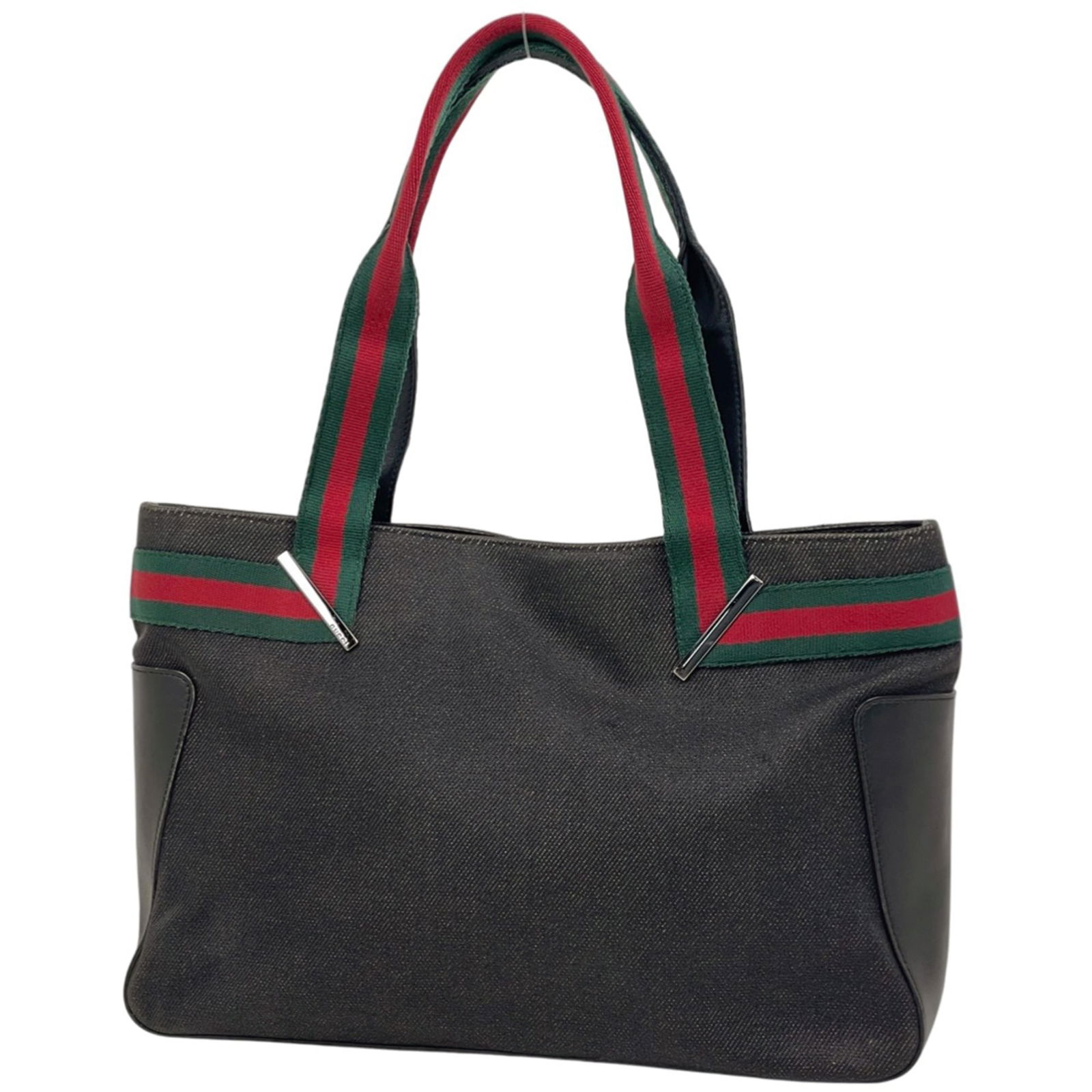 Gucci Tote Bag in Denim and Leather: Gucci Tote Bag in Denim and Leather A chic and versatile Gucci tote bag, crafted from durable denim and premium leather, boasts a sleek black hue that adds an edgy touch to any outfit. With its