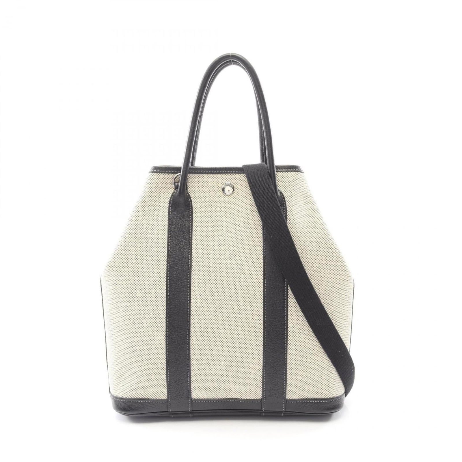 Hermes Tote Bag in Toile H Canvas and Buffalo Leather: Hermes Tote Bag in Toile H Canvas and Buffalo Leather Own a timeless piece of luxury with this pre-owned Hermes Tote Bag, crafted from rich Toile H canvas and supple buffalo leather. The classic