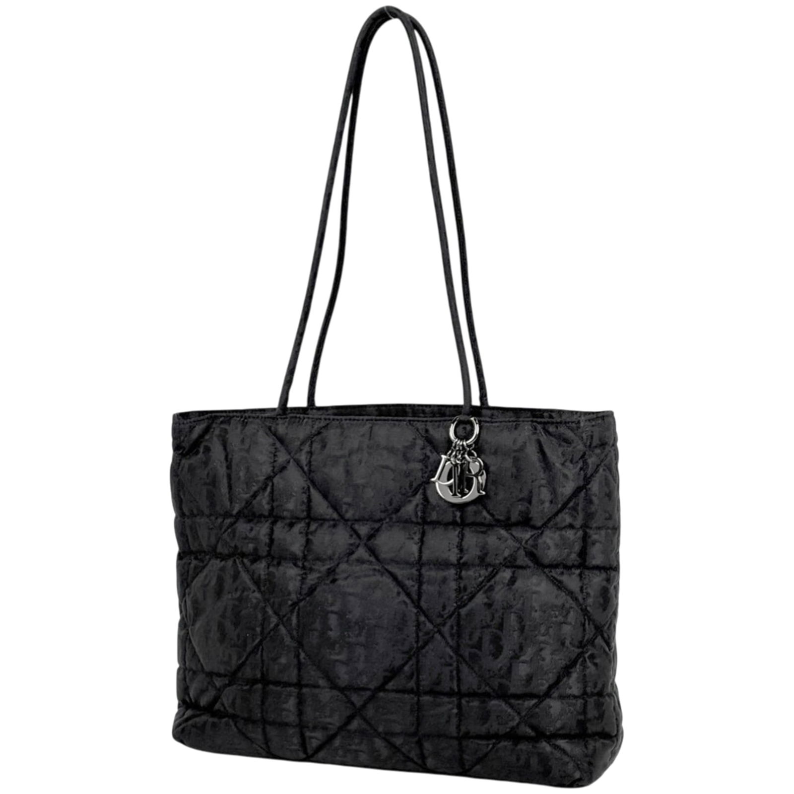 Christian Dior Tote Bag in Nylon: Christian Dior Tote Bag in Nylon A stylish and timeless Christian Dior tote bag in sleek black nylon, perfect for everyday use. With its classic design and durable material, this bag is sure to add a