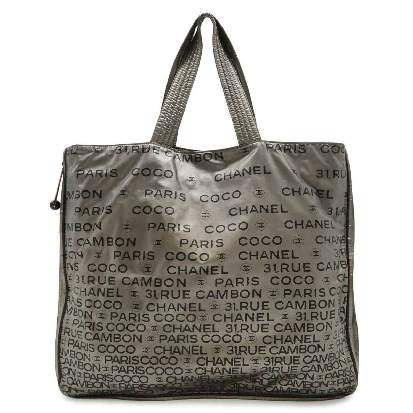 Chanel Nylon Tote Bag: Chanel Nylon Tote Bag A chic and timeless piece, this Chanel Nylon Tote Bag exudes sophistication with its sleek silver hue and durable nylon construction. With its spacious interior and classic
