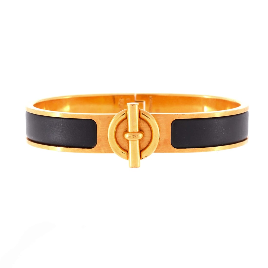 Hermes Clic Glenan Metal & Enamel Bracelet: Hermes Clic Glenan Metal & Enamel Bracelet The Hermes Clic Glenan Metal & Enamel Bracelet is a stunning piece of luxury jewelry, boasting a sleek gold-plated metal exterior with a striking black ename
