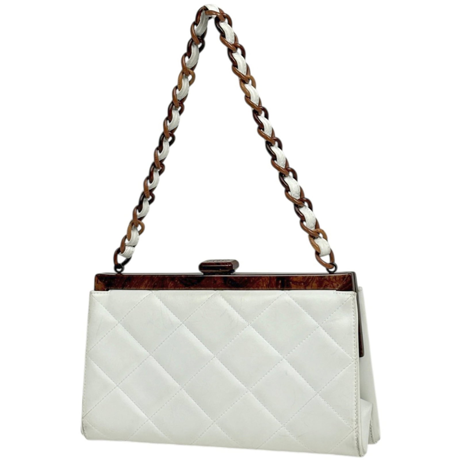 Chanel Shoulder Bag in Leather: Chanel Shoulder Bag in Leather A timeless Chanel shoulder bag in pristine white leather, perfect for adding a touch of effortless chic to any outfit. With its classic design and spacious interior,