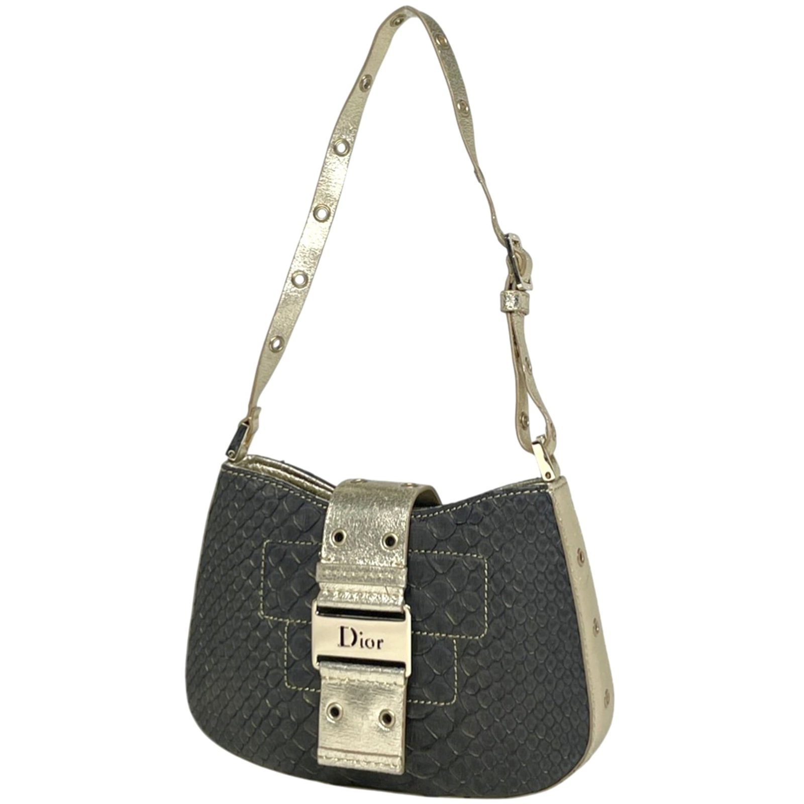 Christian Dior Shoulder Bag in Leather: Christian Dior Shoulder Bag in Leather A sleek and sophisticated shoulder bag from Christian Dior, crafted from rich black leather with subtle gold accents. This timeless piece boasts clean lines and