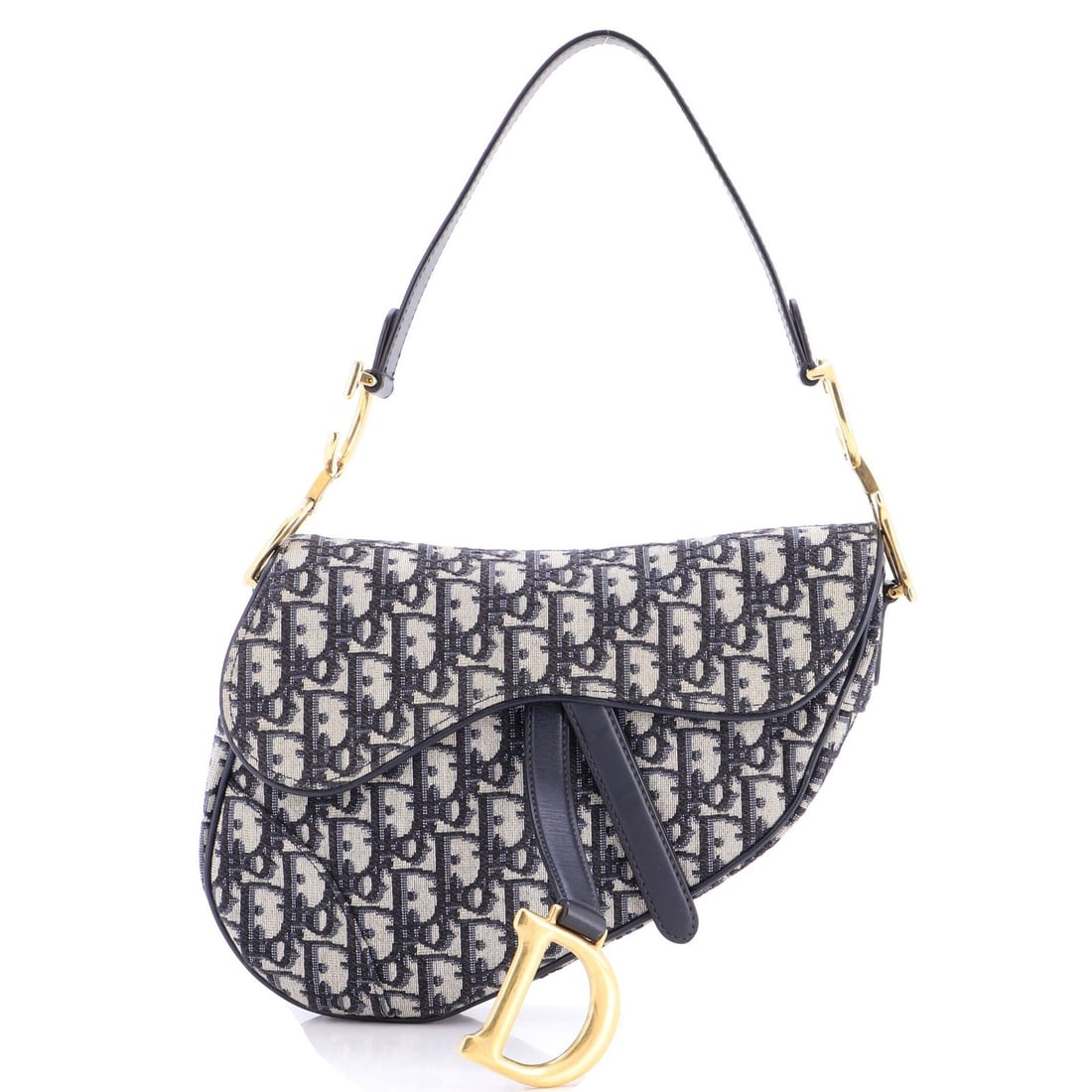 Christian Dior Saddle Handbag in Medium Oblique Canvas: Christian Dior Saddle Handbag in Medium Oblique Canvas The Christian Dior Saddle Handbag in Medium Oblique Canvas is a timeless classic, boasting a striking blue canvas exterior and neutral interior.