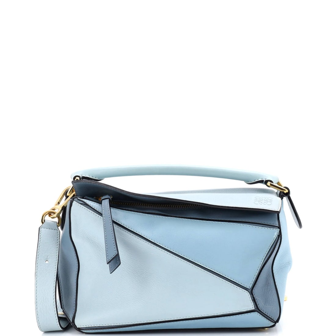 Loewe Small Leather Puzzle Bag: Loewe Small Leather Puzzle Bag The Loewe Small Leather Puzzle Bag is a timeless and stylish accessory that exudes sophistication with its sleek blue exterior and gold hardware. Its compact size belies