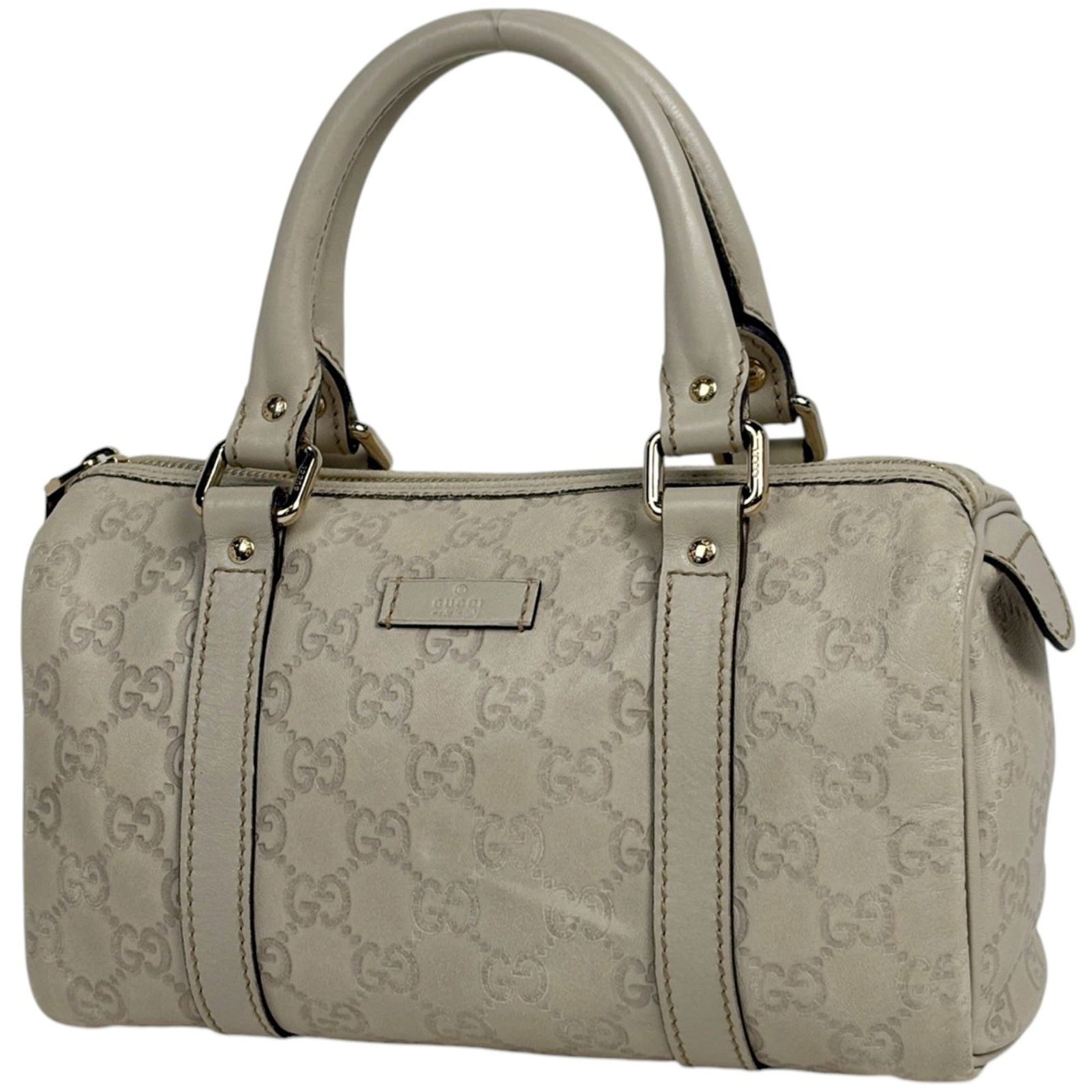 Gucci Leather Handbag: Gucci Leather Handbag A timeless piece from the iconic Gucci brand, this ivory leather handbag boasts classic elegance with its clean lines and sophisticated design. With its spacious interior and