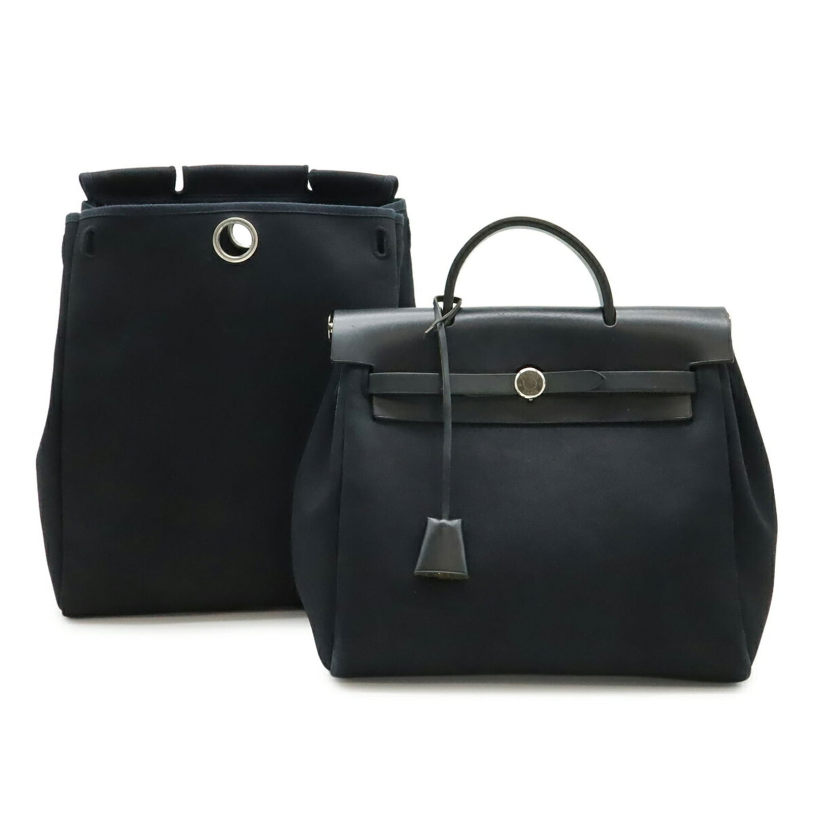 Hermes Toile Officier Leather Backpack and Handbag: Hermes Toile Officier Leather Backpack and Handbag A rare find for the discerning collector, this Herm?s Toile Officier leather backpack and handbag exudes timeless elegance with its classic design