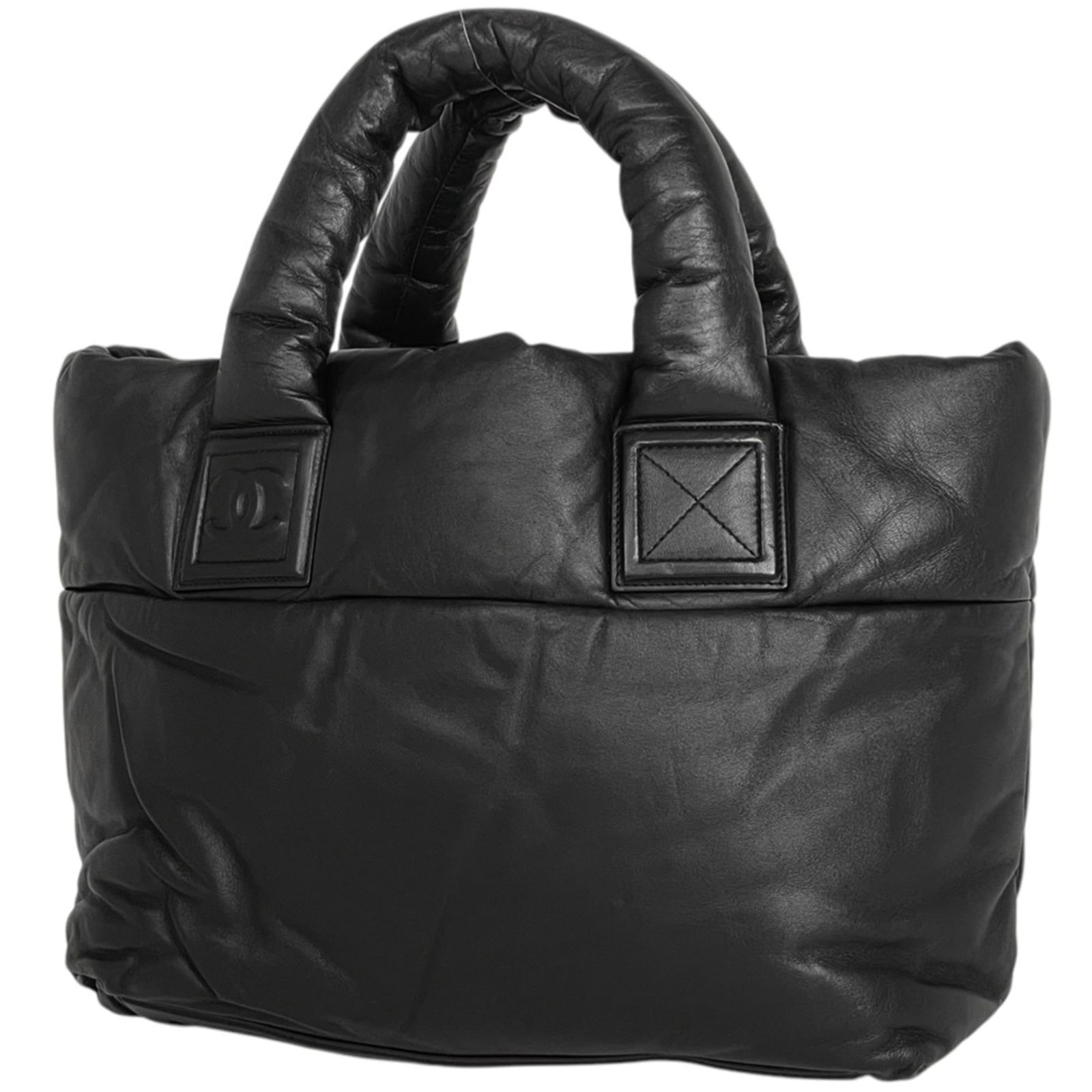 Tote Bag Leather - Chanel Handbag: Tote Bag Leather - Chanel Handbag A sleek and sophisticated Chanel tote bag, crafted from rich black leather, boasts a timeless design that exudes elegance and refinement. With its classic 25cm x