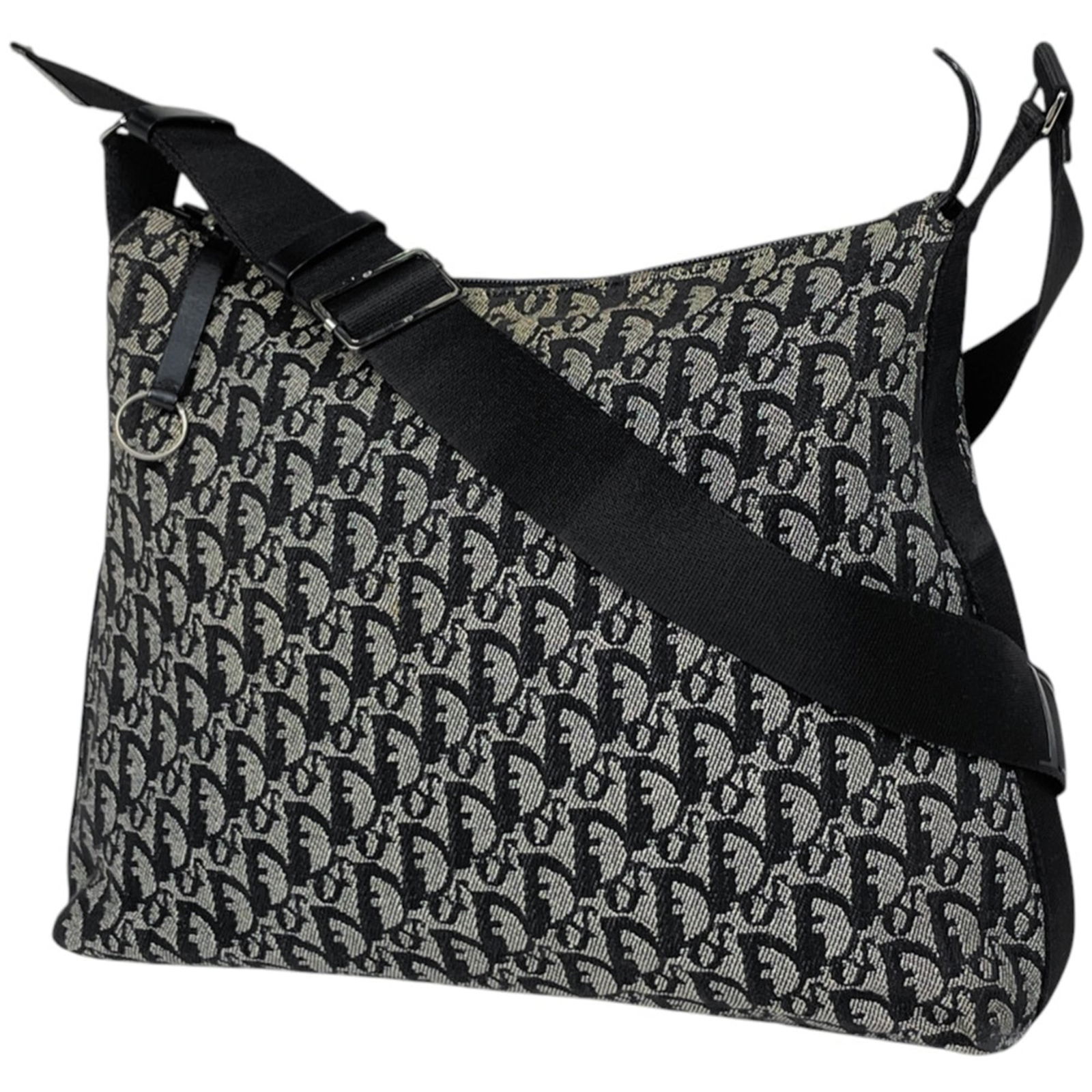 Christian Dior Shoulder Bag in Leather and Canvas: Christian Dior Shoulder Bag in Leather and Canvas A timeless Christian Dior shoulder bag, crafted from luxurious leather and canvas, boasts a sleek black design that exudes sophistication. With its