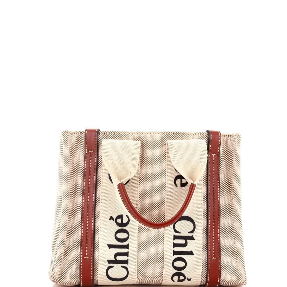 Small Chloe Woody Tote Canvas with Leather: Small Chloe Woody Tote Canvas with Leather The Chloe Woody Tote Canvas with Leather is a timeless and versatile accessory that combines the effortless style of canvas with the luxurious touch of