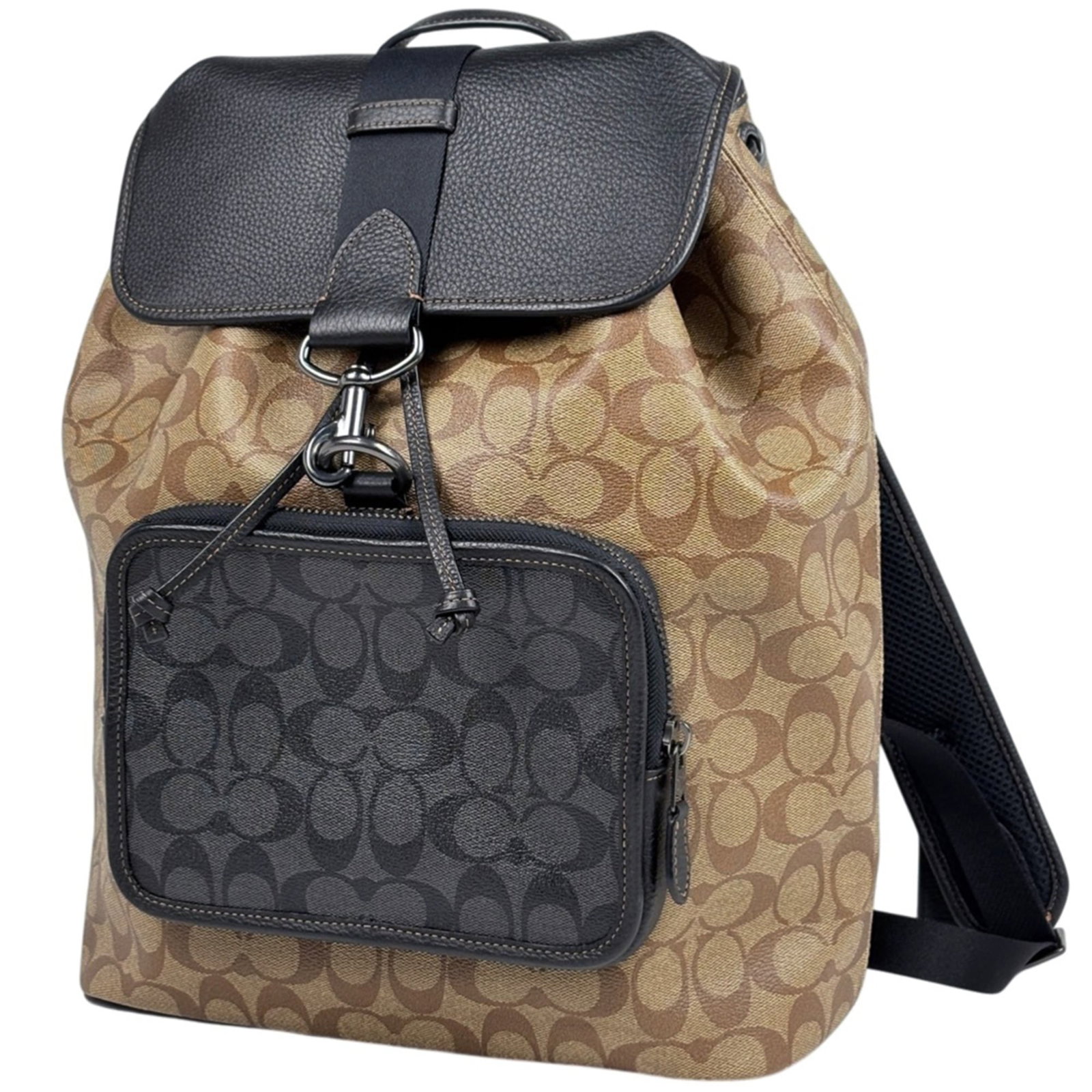 Coated Canvas and Leather Coach Backpack: Coated Canvas and Leather Coach Backpack A pre-owned Coach backpack with a timeless appeal, this coated canvas and leather bag boasts a sleek black finish with brown accents, perfect for adding a touc