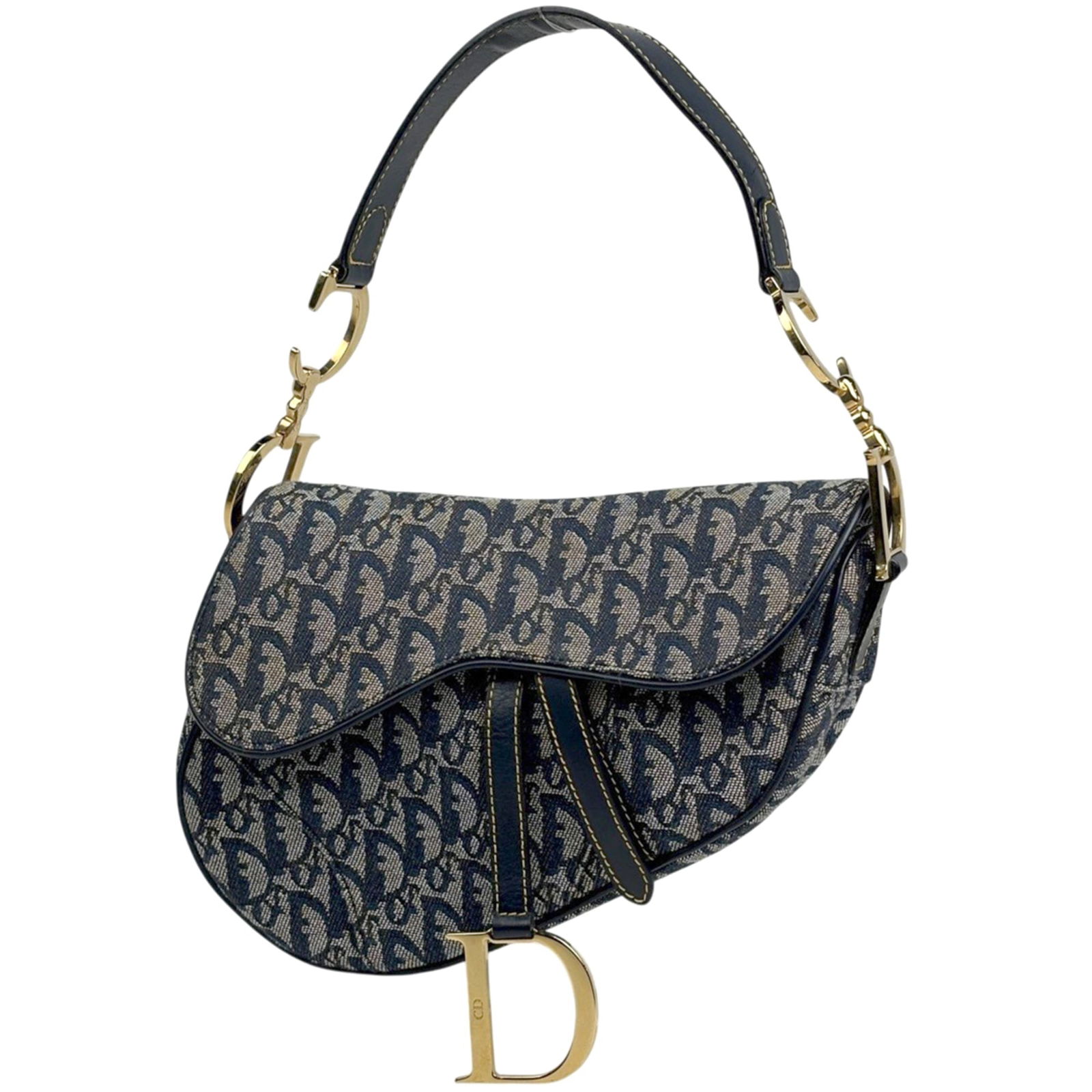 Christian Dior Saddle Shoulder Bag in Canvas and Leather: Christian Dior Saddle Shoulder Bag in Canvas and Leather A timeless piece from Christian Dior, this navy canvas and leather saddle shoulder bag exudes classic sophistication with its sleek design and
