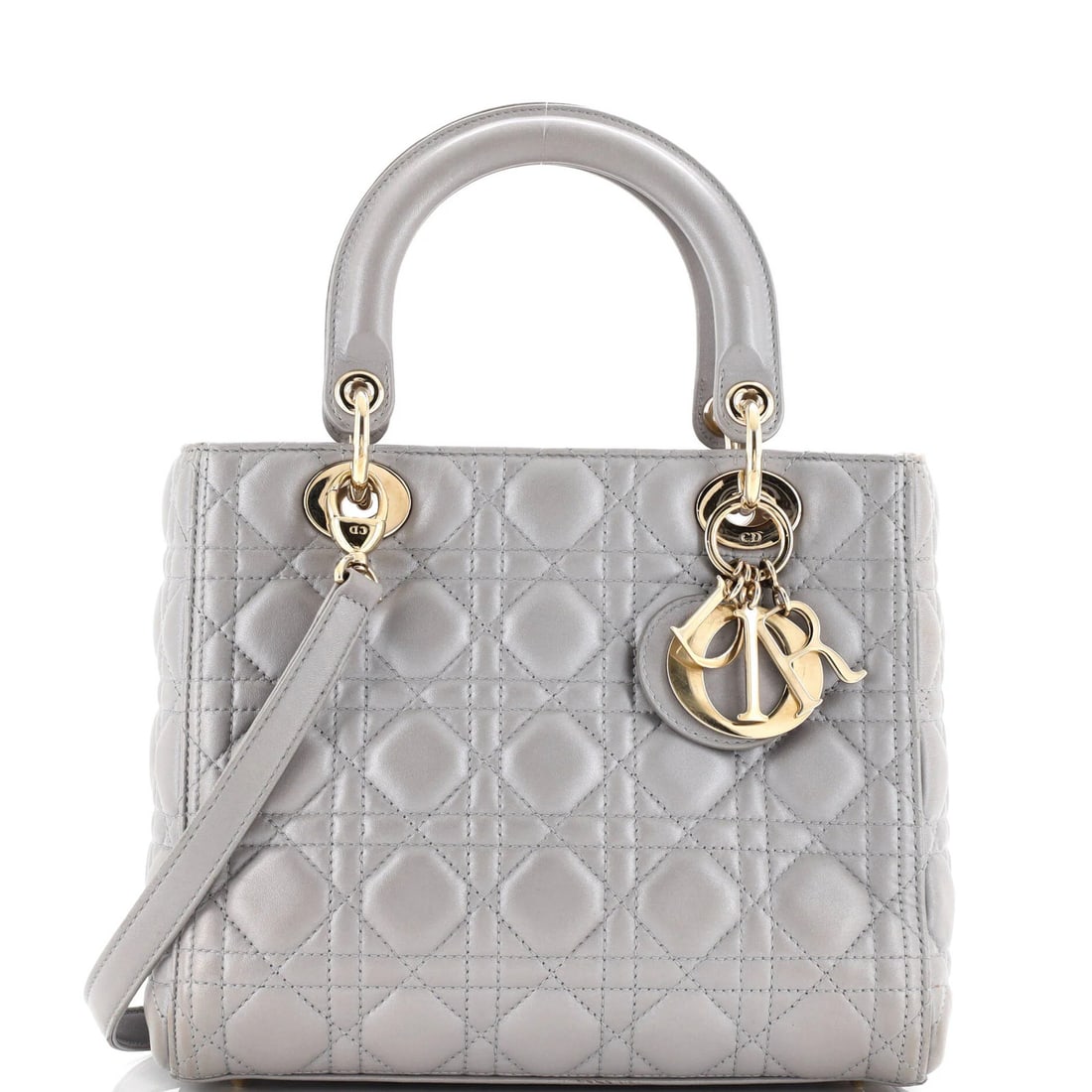 Christian Dior Lady Dior Bag - Cannage Quilt Lambskin Medium: Christian Dior Lady Dior Bag - Cannage Quilt Lambskin Medium The iconic Christian Dior Lady Dior Bag is a timeless classic, boasting sleek silver hardware and a luxurious Cannage Quilt Lambskin exteri