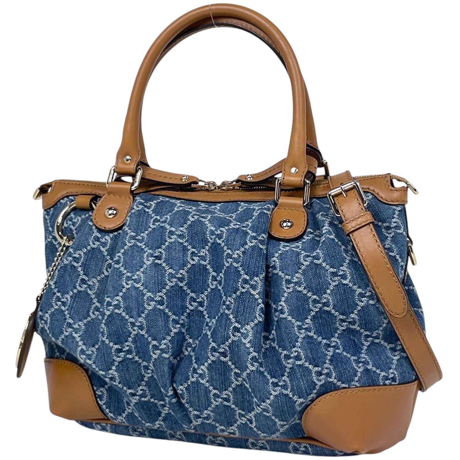 Gucci Denim Leather Shoulder Bag: Gucci Denim Leather Shoulder Bag A stunning Gucci denim leather shoulder bag, boasting the iconic Italian brand's signature style and craftsmanship. With its rugged blue hue and premium materials,