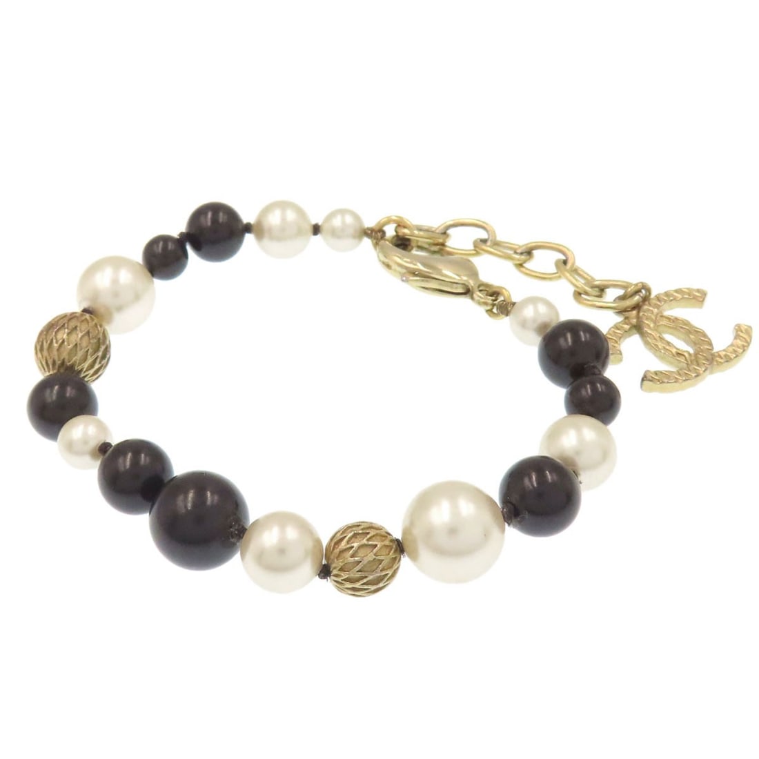 Coco Chanel Faux Pearl Metal Bracelet: Coco Chanel Faux Pearl Metal Bracelet Elevate your style with the timeless elegance of Coco Chanel, as embodied in this exquisite faux pearl metal bracelet. Crafted from high-quality gold and black ac