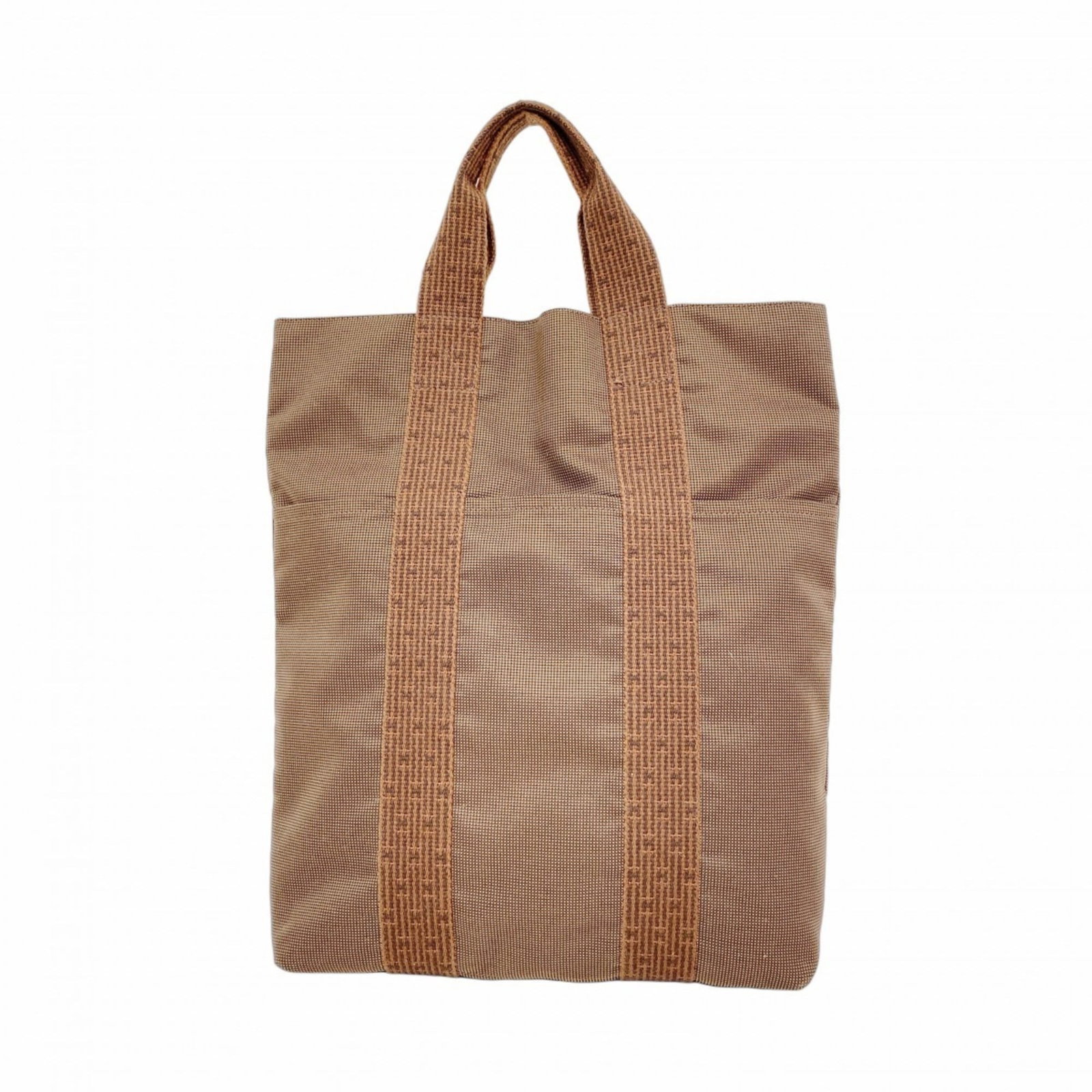 Hermes Canvas Tote Bag: Hermes Canvas Tote Bag A pre-owned Hermes canvas tote bag in rich brown, adorned with sleek silver hardware, offers a timeless and sophisticated touch to any outfit. With its sturdy 7cm height and