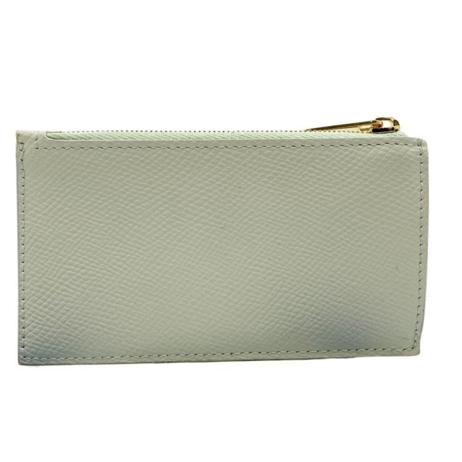 Celine Coin Purse/ Case Leather: Celine Coin Purse/ Case Leather A pre-owned Celine leather coin purse in a beautiful light green hue, featuring a compact size and sleek design that makes it perfect for everyday use. With its