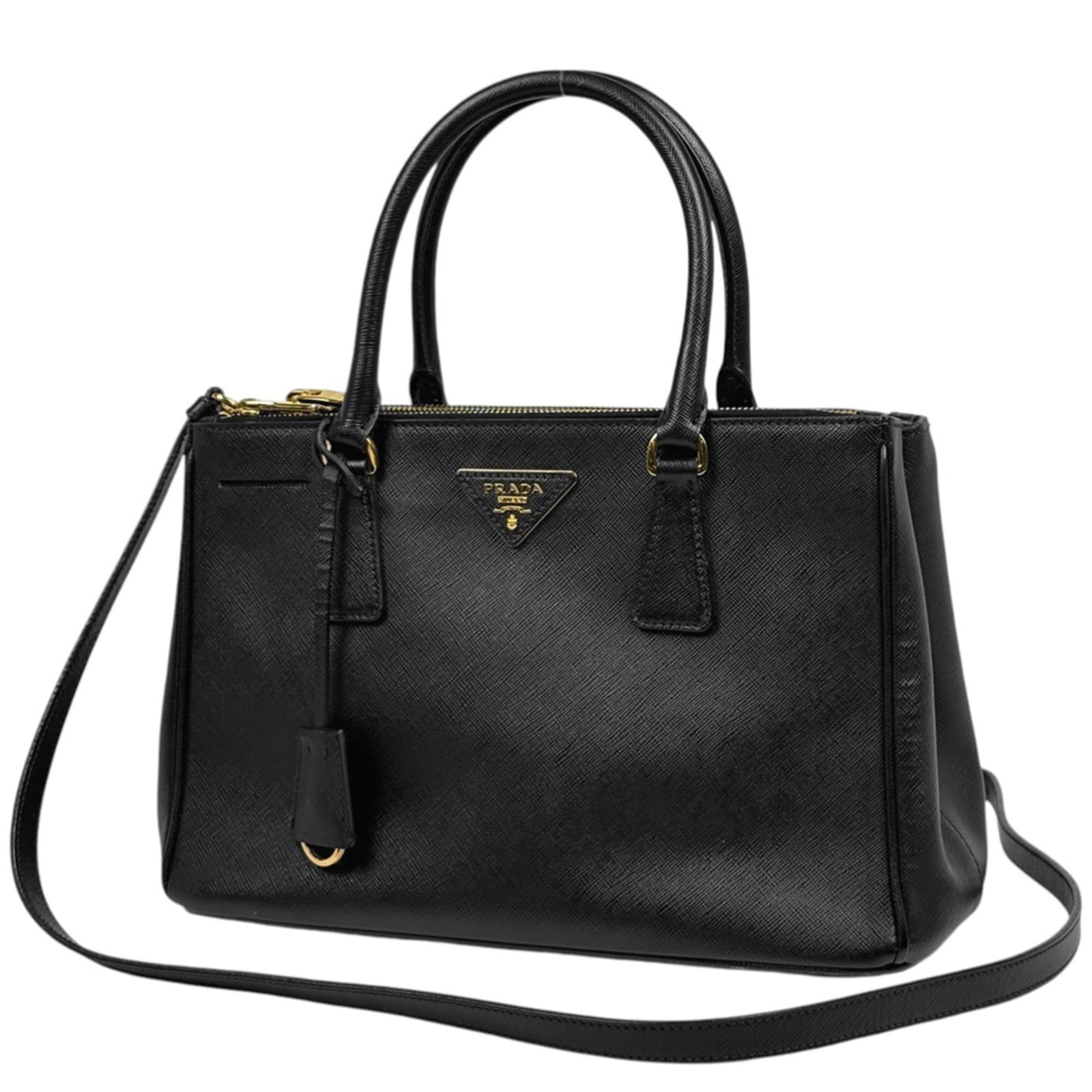 Prada Leather Shoulder Bag: Prada Leather Shoulder Bag A timeless and sophisticated Prada leather shoulder bag, crafted from high-quality Saffiano leather, boasts a sleek black finish that exudes elegance. With its classic desig