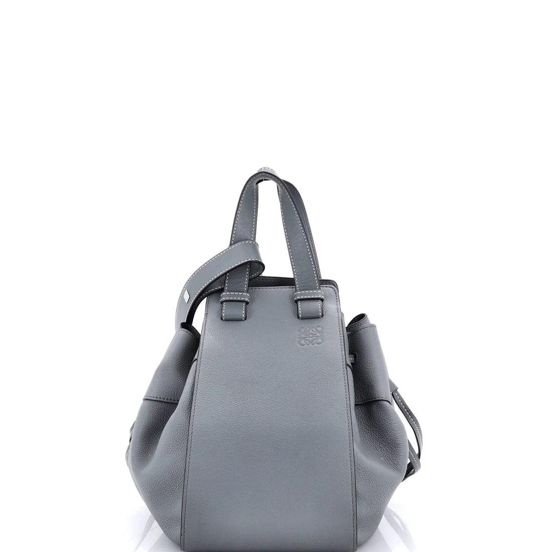 Loewe Small Leather Hammock Nugget Bag: Loewe Small Leather Hammock Nugget Bag The Loewe Small Leather Hammock Nugget Bag is a stylish and compact cross-body bag that exudes effortless chic. With its soft gray leather exterior, neutral inte
