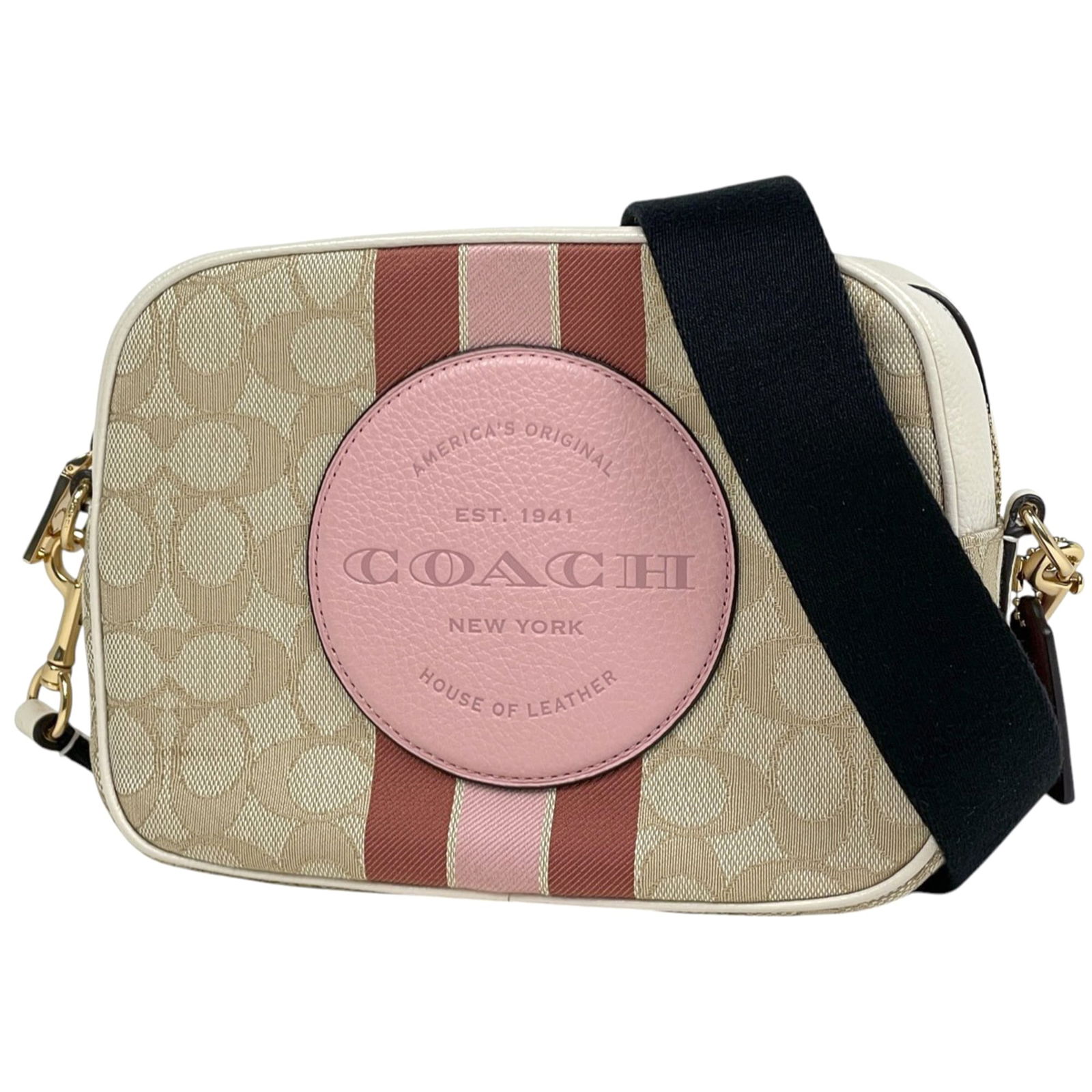 Canvas and Leather Coach Shoulder Bag: Canvas and Leather Coach Shoulder Bag A timeless Coach shoulder bag, this beige canvas and leather tote boasts classic style with a touch of sophistication. Its spacious interior and comfortable