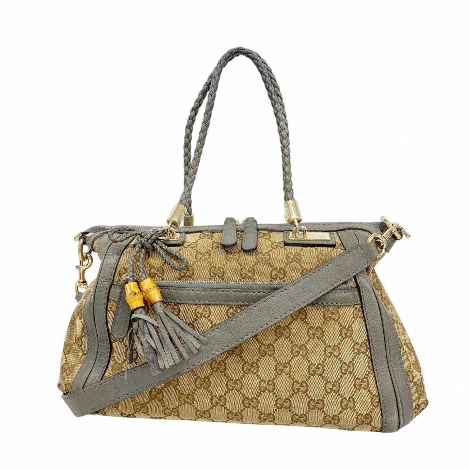 Gucci Canvas Handbag: Gucci Canvas Handbag A timeless Gucci canvas handbag in beige and gray, adorned with champagne gold hardware, adds a touch of sophisticated elegance to any outfit. With its classic design and durable