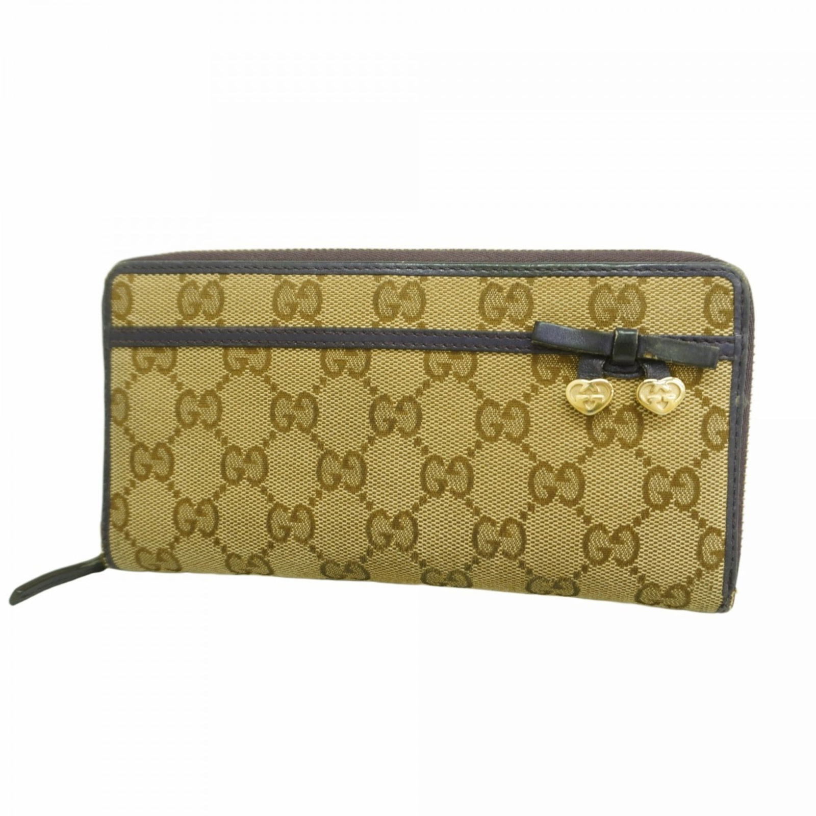 Gucci Bi-Fold Canvas Wallet: Gucci Bi-Fold Canvas Wallet A pre-owned Gucci bi-fold canvas wallet in rich beige and purple hues, boasting the iconic Italian brand's signature style. With its classic design and durable canvas