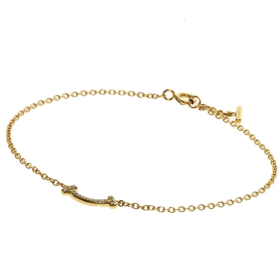 Tiffany & Co. K18 Yellow Gold T Smile Mini Diamond Bracelet: Tiffany & Co. K18 Yellow Gold T Smile Mini Diamond Bracelet Elevate your everyday style with the Tiffany & Co. K18 Yellow Gold T Smile Mini Diamond Bracelet, a delicate yet sophisticated accessory