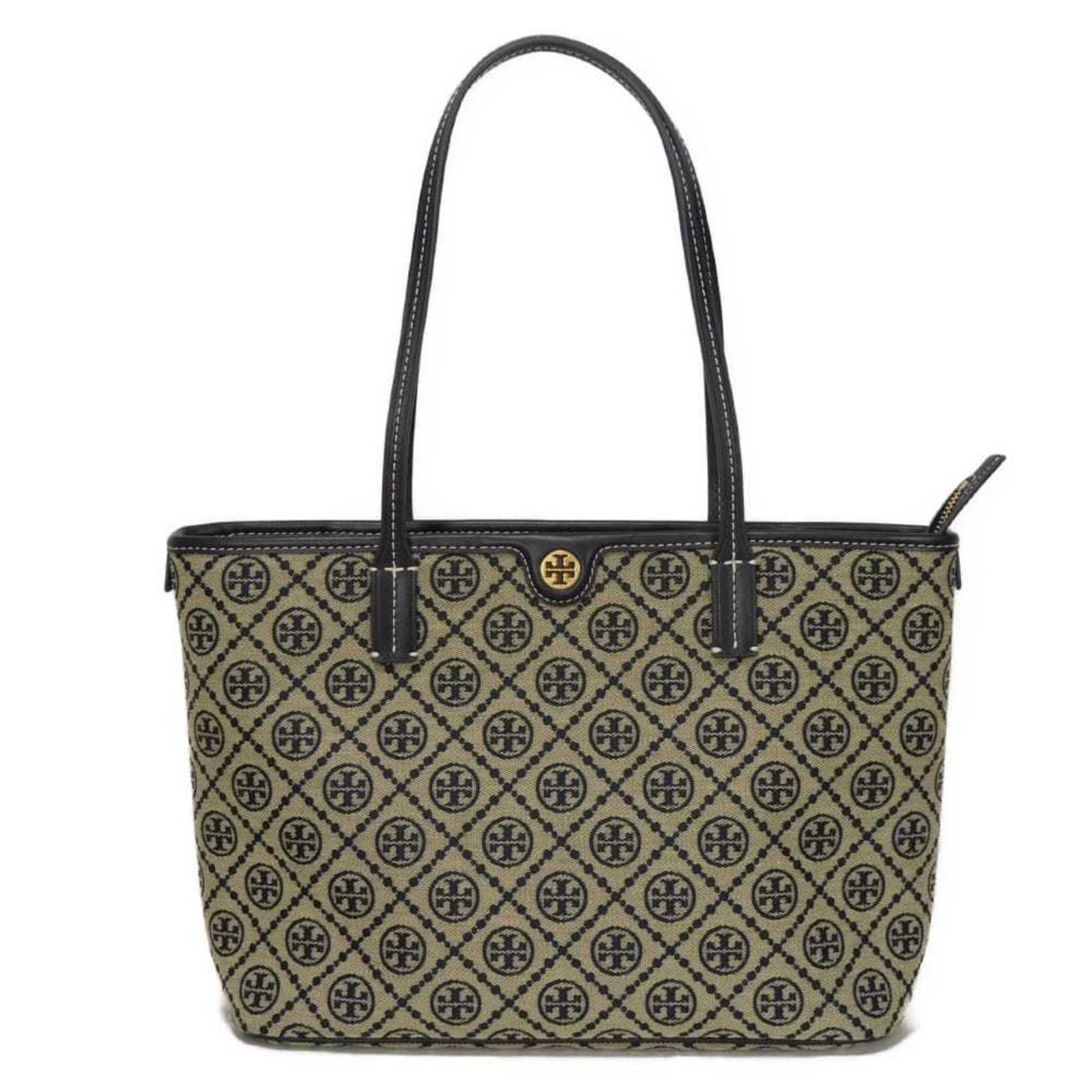 Tory Burch Jacquard Leather Tote Bag: Tory Burch Jacquard Leather Tote Bag Experience the effortless elegance of Tory Burch with this stunning Jacquard leather tote bag, boasting a timeless navy hue and sleek matte gold hardware that